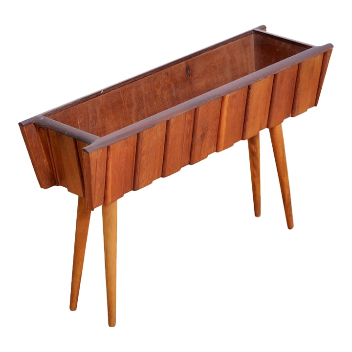 Mid Century Wooden Plant Stand: Mid century planter produced in England during the early 1960s. A nicely crafted plant stand with delicate splayed legs. Condition: Alterations: Original Condition Unaltered Imperfections: Some Imperf