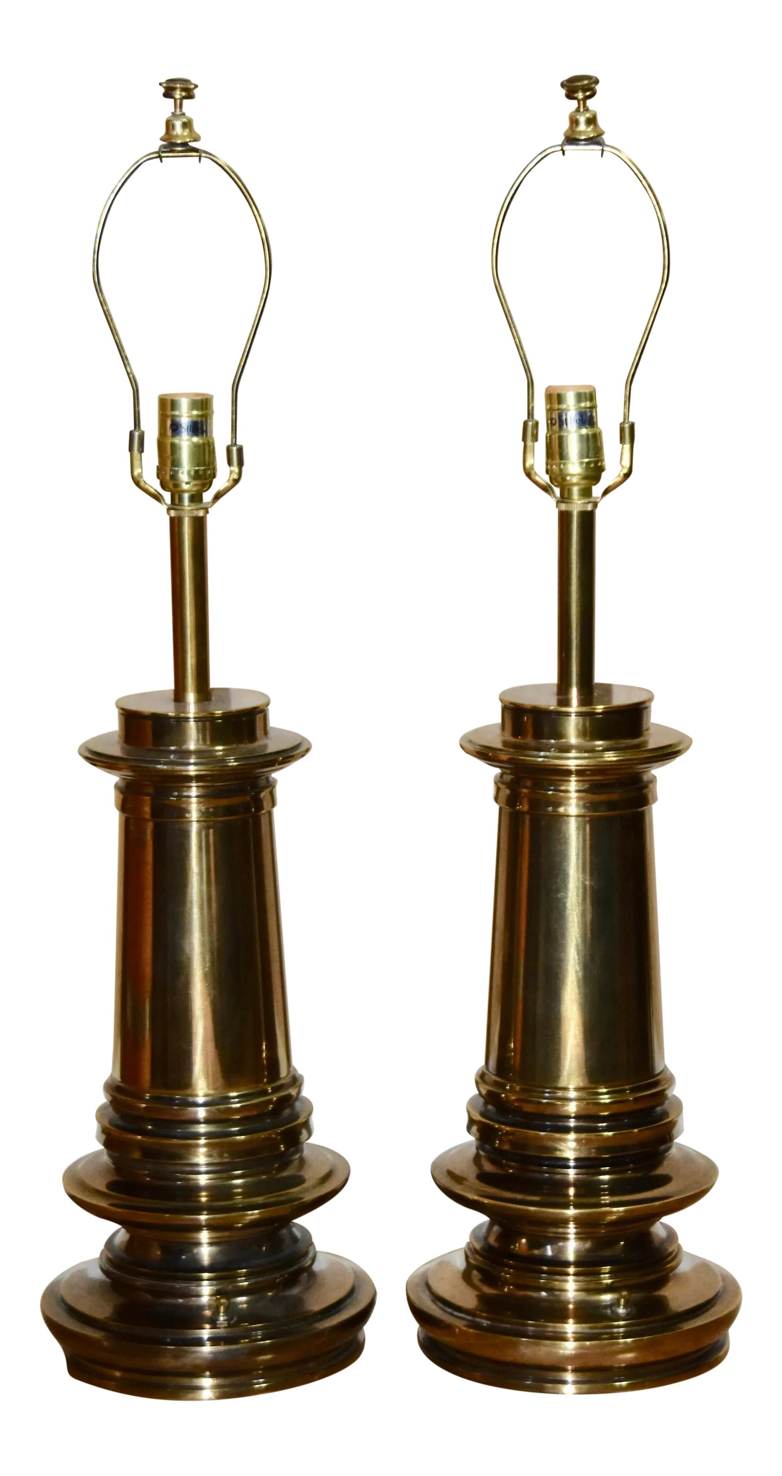 1960s Stiffel Hollywood Regency 3 Way Brass Urn Table Lamps - a Pair: Striking pair of architectural brass urn lamps by Stiffel. Stunning silhouette, very heavy and substantial lamps with good patina. Stiffel labels are on the sockets. Takes standard three way light
