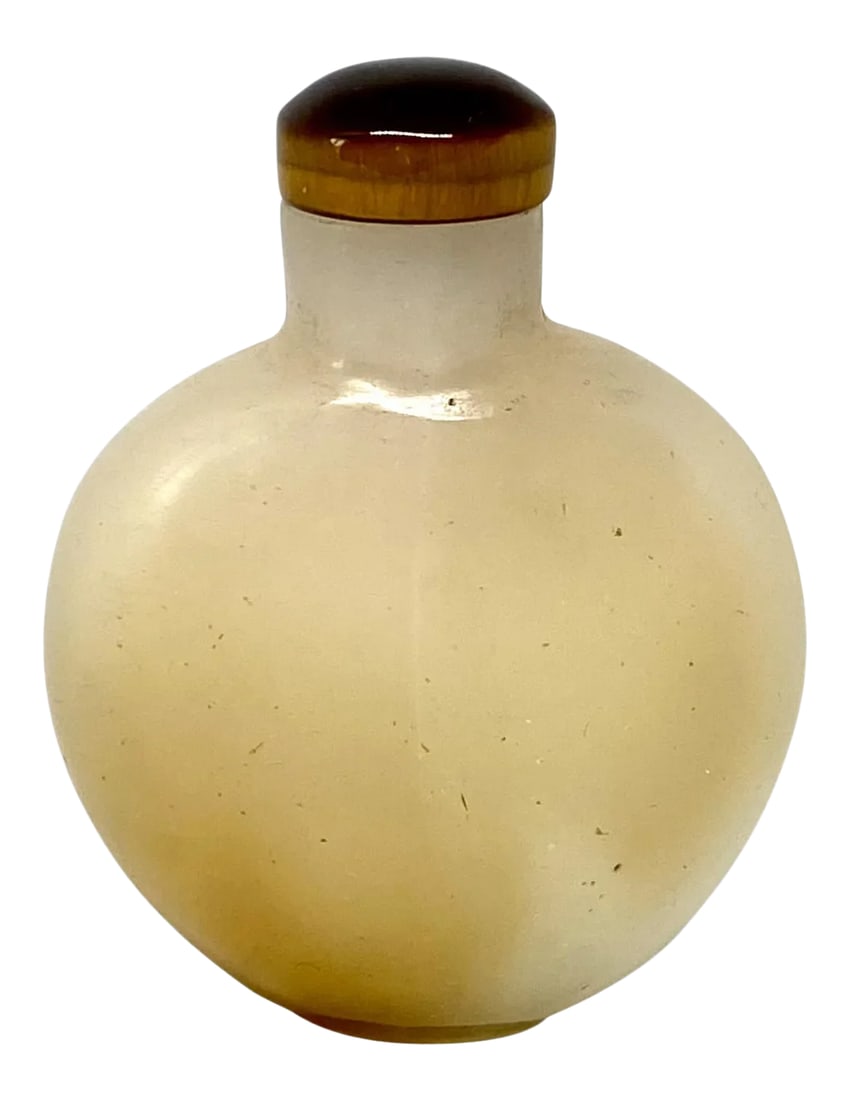 Late 19th Century Chinese Agate Snuff Bottle: A fine late 19th century or early 20th century Chinese agate snuff bottle. The top is a piece of carved tiger eye. The bottle itself is a caramel-colored hard stone. Condition is very good. Circa: