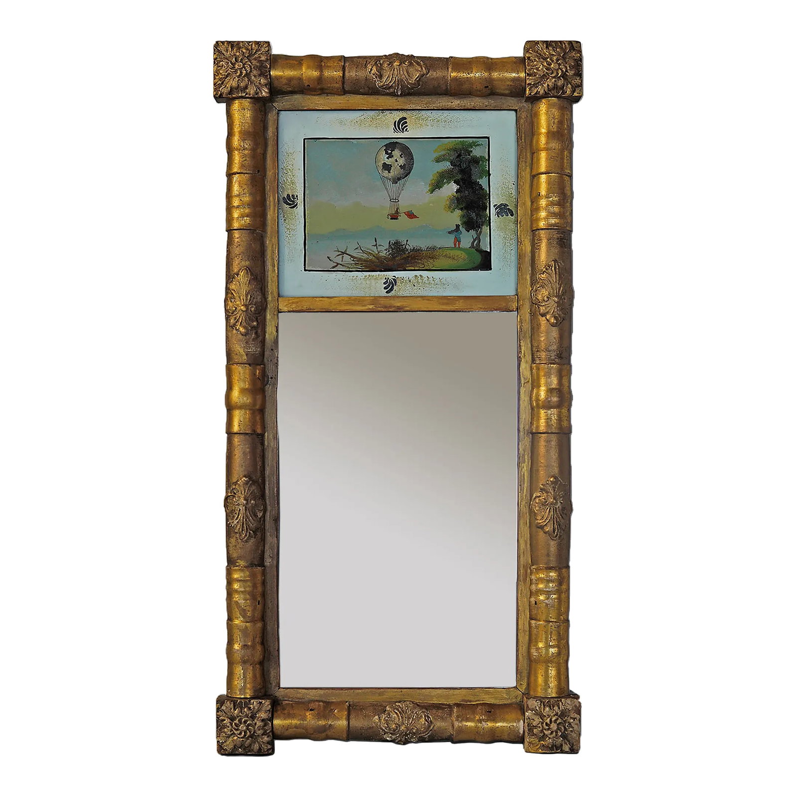 Antique Giltwood Eglomise Mirror: Antique Federal era giltwood mirror with reverse painted glass scene of a hot air balloon passing over a landscape. Mirror is original with specks throughout (please see photos). Condition: