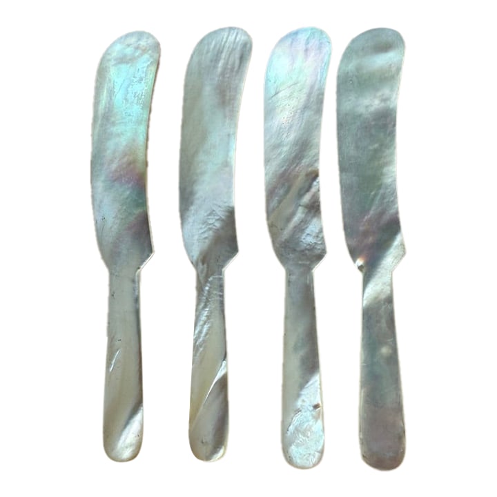 Vintage Mother of Pearl Cocktail/Cavier Knives- Set of 4: Vintage Mother of Pearl Caviar, Cocktail Size, Knives, Set of 4. Per Marky's Gourmet Foods: "Mother of Pearl knives, crafted from the inner layer of oyster, abalone, and other mollusk shells, are