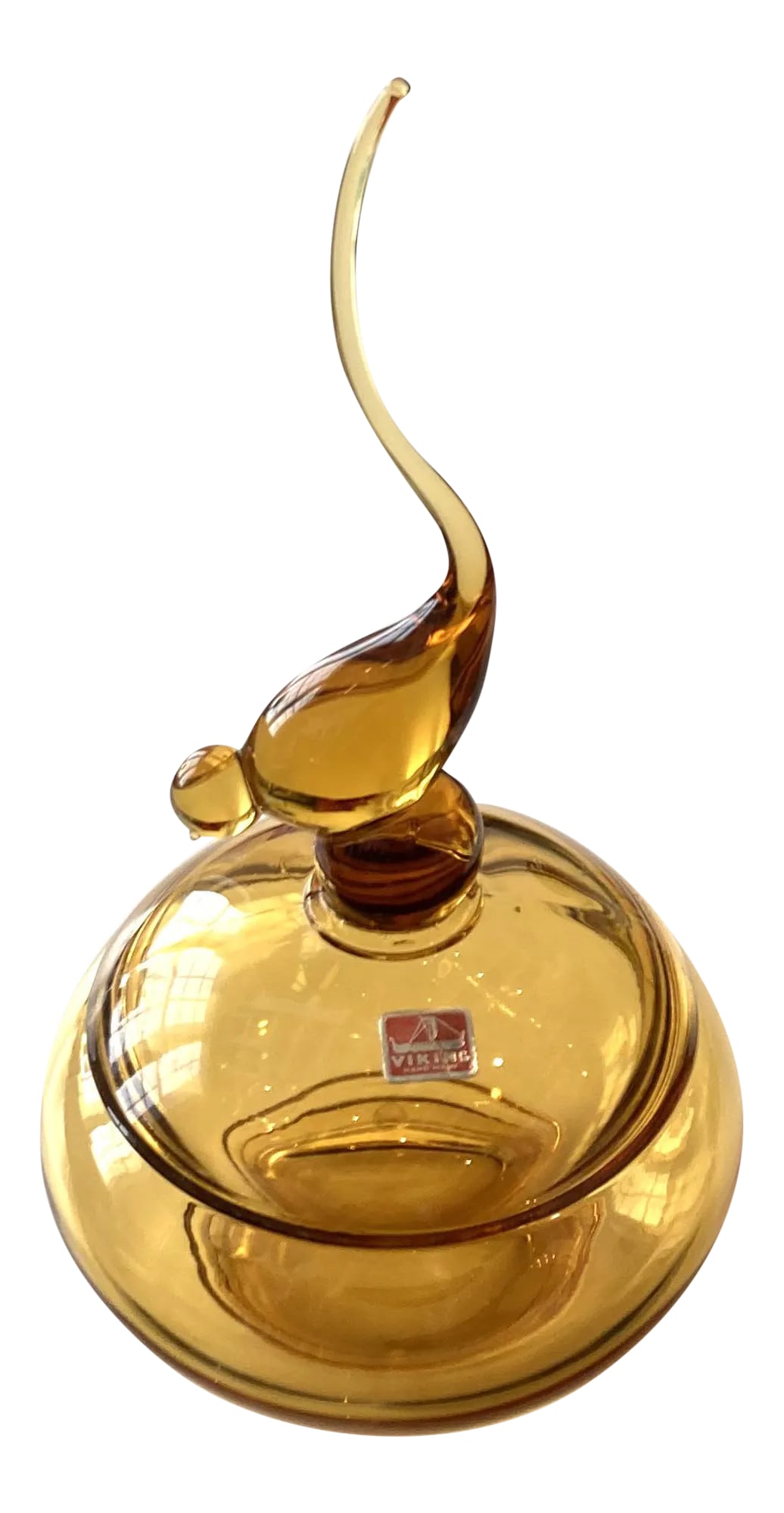 Vintage 1960s Viking Tailed Bird Candy Jar in Amber: This Vintage, Viking Tailed, Art Glass, Bird Candy Jar in amber color is from the 1960s. It features a long-tailed bird extending 8" tall on the lid. The dish is 6" in diameter with an overall height