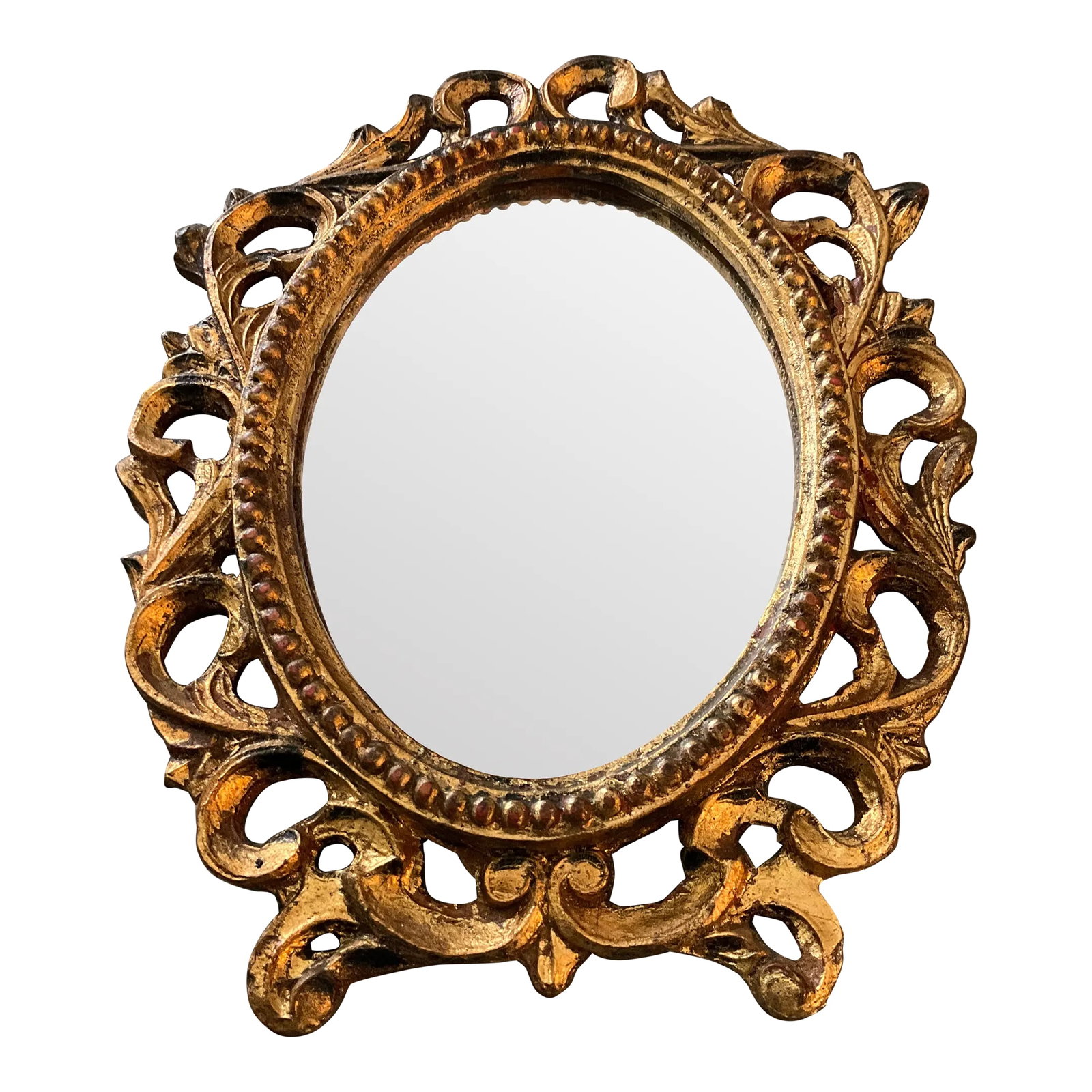 Vintage Italian Florentine Giltwood Ornate Mirror: Beautiful vintage Giltwood Mirror with Gold leaf finish detail. Italian Florentine, which is a molded wood composite material. Delicately crafted and in good vintage condition. The mirror is in perfec