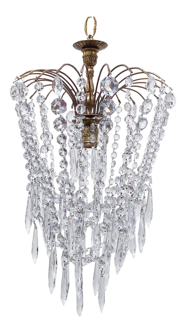 1960s Parachute Chandelier With Graduated Chain Crystals: Parachute chandelier with brass wired dome, octagon chain, graduated chain and 30% leaded U-drop crystals. It has an Edison base socket that it can hold up to 100W light bulb. #57 Condition: