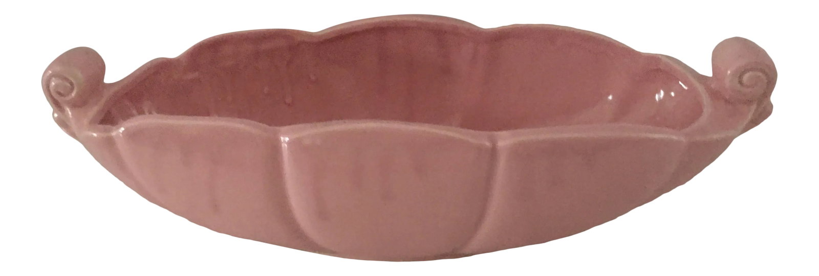 1950's Pink Abingdon Console Bowl Usa: 1950's pink pottery console bowl with scalloped border. Believed to be Abingdon pottery, however the piece is not signed. Made in the USA. Measures 15"w x 5.5" d x 4"h. Free of any chips cracks or