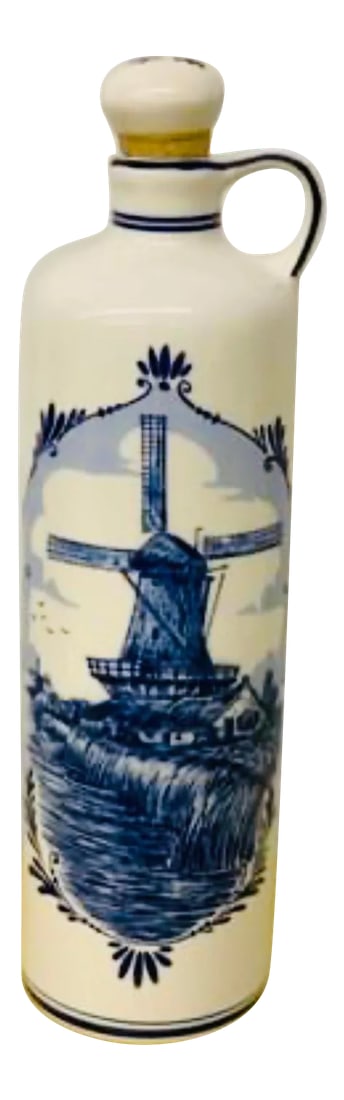 Mid-Century 1950's Delft Blue Holland Ceramic Bottle: Beautiful Vintage Delft Holland Bottle with Handle and Cork. Perfect addition to any MCM decor and adds a little European flair! Excellent vintage condition! Measures 11" tall. Condition: Alterations:
