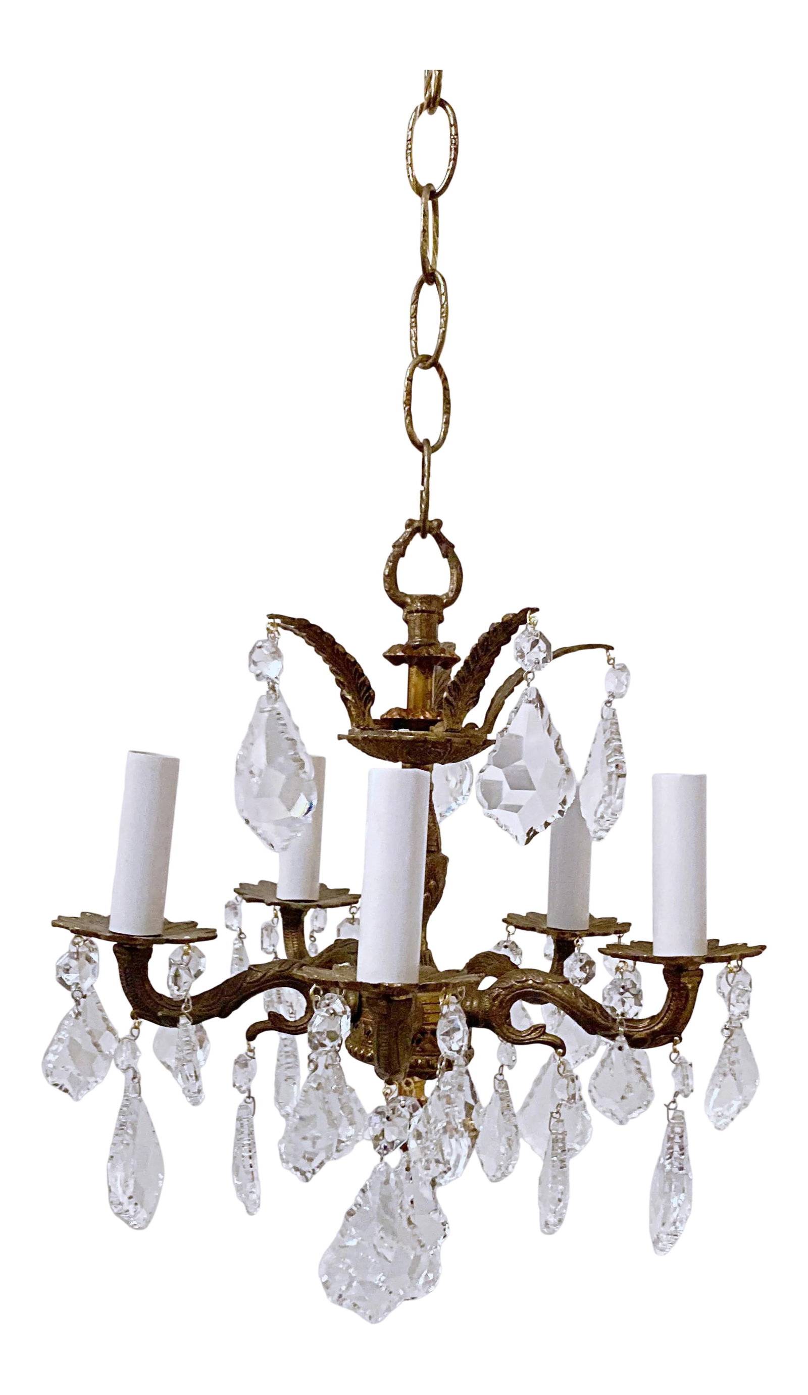 1950s Brass Chandelier With French Pendalogue Crystals: This is a small Spanish brass chandelier with 30% leaded French Pendalogue cut drop crystal and octagon chain. The chandelier it was rewired to meet the standards and it has five candelabra base
