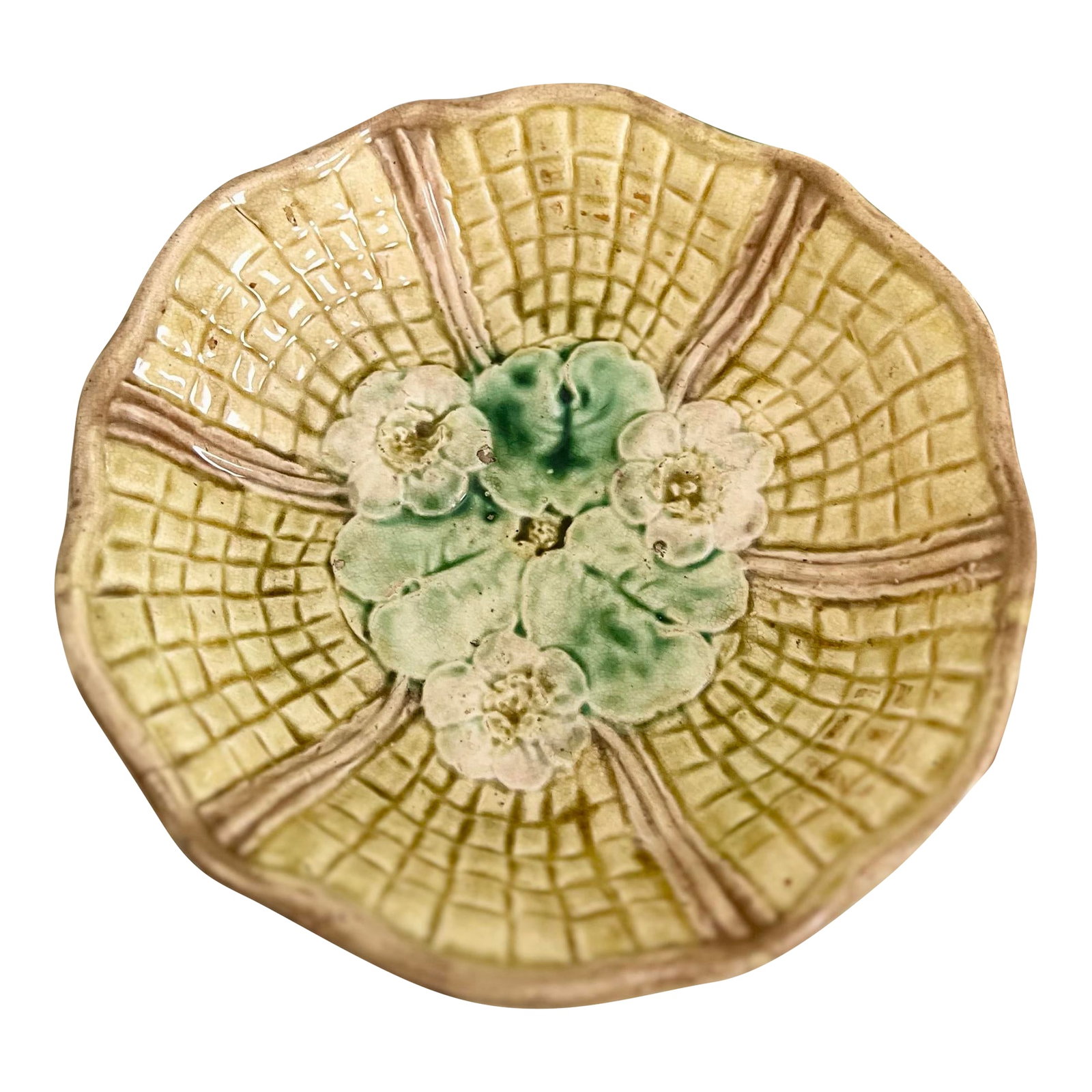 Vintage Majolica Lily Pad Footed Bowl: A charming vintage majolica bowl featuring a sculptural lily pad design and graceful footed base. The rich glaze showcases soft green and earthy tones with beautiful depth and variation. Perfect as a