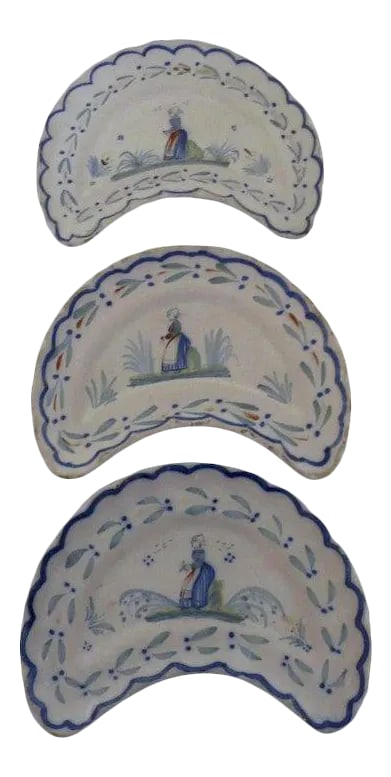 Henriot Quimper Faience Cresent Salad Plates c 1920 - Set of 3: These are charming crescent shaped plates by Henriot Quimper. Nice thick glaze, hole on the back for hanging. Have edge chips. Please see photos. Measure about 9 1/4" by 7 1/2". Condition: Alterations