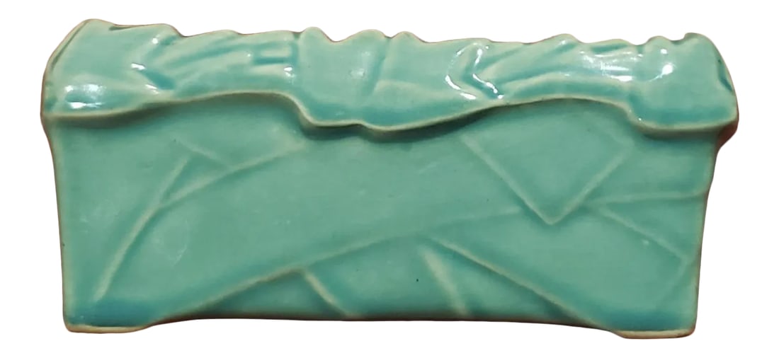 1940s McCoy Ivy Strap Rectangular Planter in Teal: This vintage ceramic & very collectible Mccoy window sill/planter stand display planter was made in the 1930s. It measures 6.5 inches wide by 2.75 inches tall & 3.25 inches deep. This the rectangular 