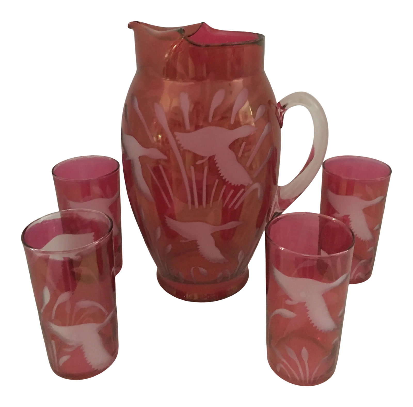 Vintage Cranberry Glass Pitcher and Tumblers: Festive cranberry glass pitcher and four matching tumblers , each holding 12 ounces of your favorite beverage ! Pristine condition . Circa 1950's Made in USA ! Thank you. ! Condition: Alterations: Ori