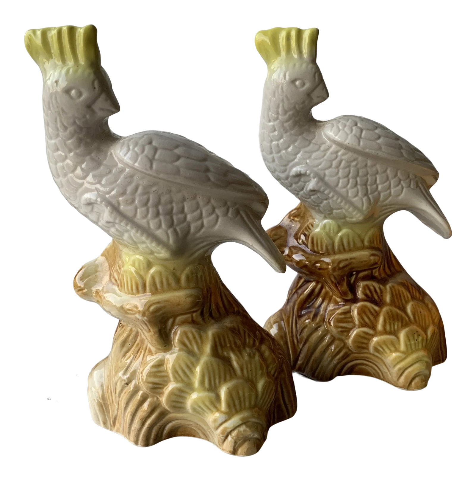 1990s Brazilian Colorful Ceramic Bird Figurines- a Pair: A pair of figurines that would look great on a bookshelf. White with touches of yellow and then brown on their perches. Condition: Alterations: Original Condition Unaltered Imperfections: Some