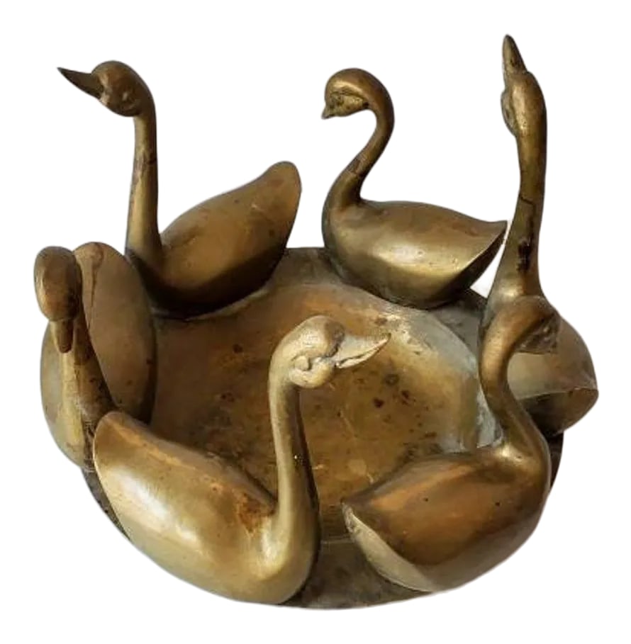 Mid-Century Asian Patinated Brass Swan Bowl: A vintage Asian solid brass decorative object, dating to around the mid 20th century, having six elegant brass swan figures mounted on a circular dish shaped heavy-duty base. Nicely aged original