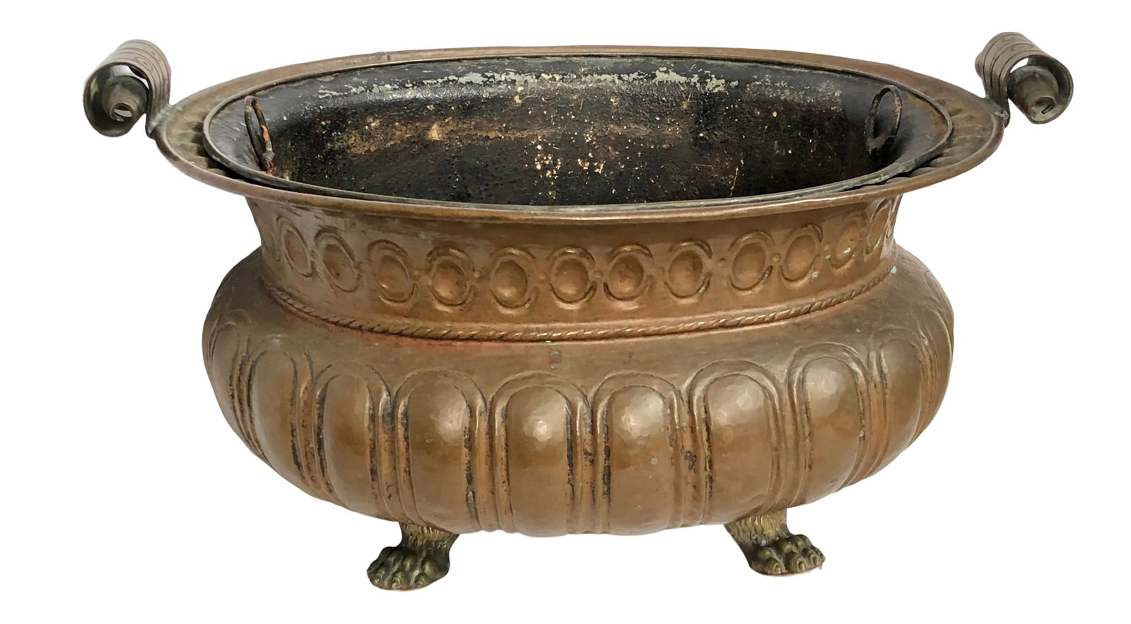 Copper Jardiniere With Liner: Hand hammered and tooled copper jardiniere with liner and brass lion feet. No holes seen in liner or jardiniere. Condition: Alterations: Original Condition Unaltered Imperfections: Some Imperfections