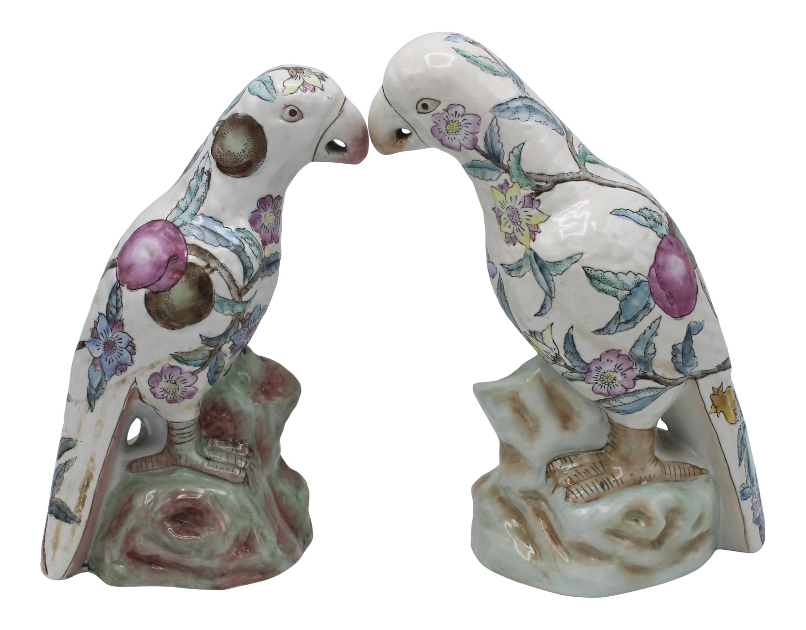 Large Mid Century Famille Rose Chinese Export Parrot Figurines - Set of Two: A stunning duo of Mid Century Famille Rose Chinese Parrots, circa 1940. You will love this floral and fruit patterned pair of parrots. Dimensions: larger parrot= 10.5" tall smaller parrot= 9.75" tall