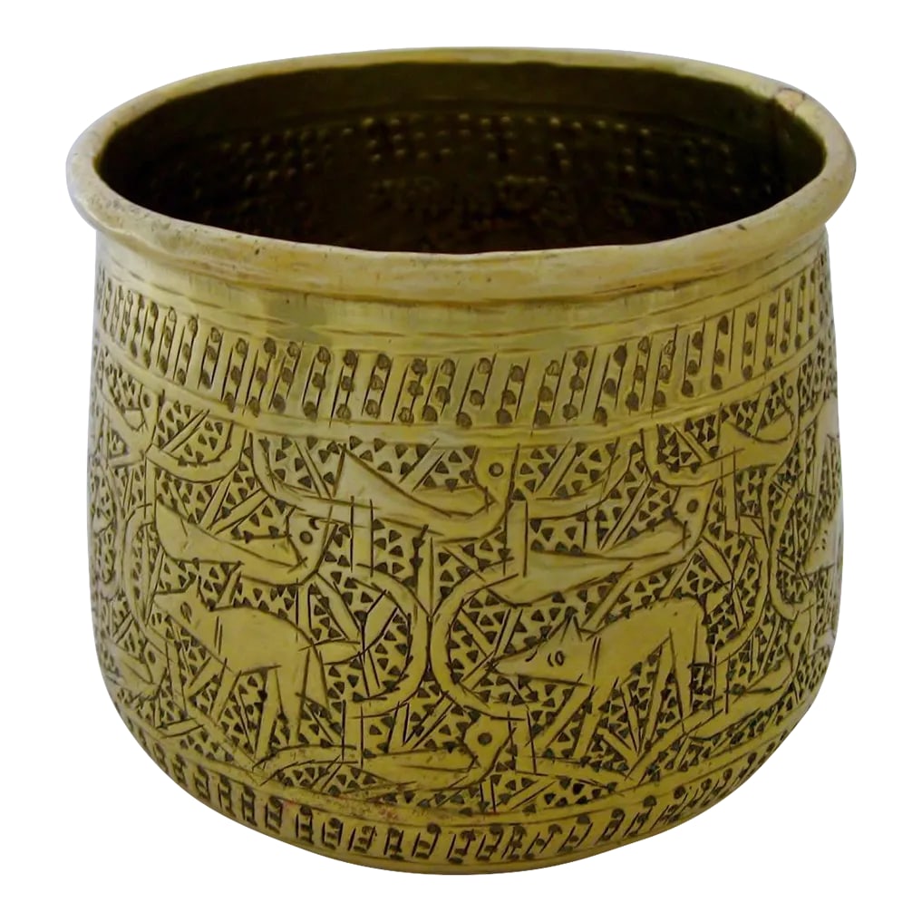 Late 19th Century Middle Eastern Brass Cup: Middle Eastern handmade brass cup with primitive animal and reticulated calligraphy. Unmarked, dated to late 19th-early 20th century. Good condition with a few underside dents, expected age and use