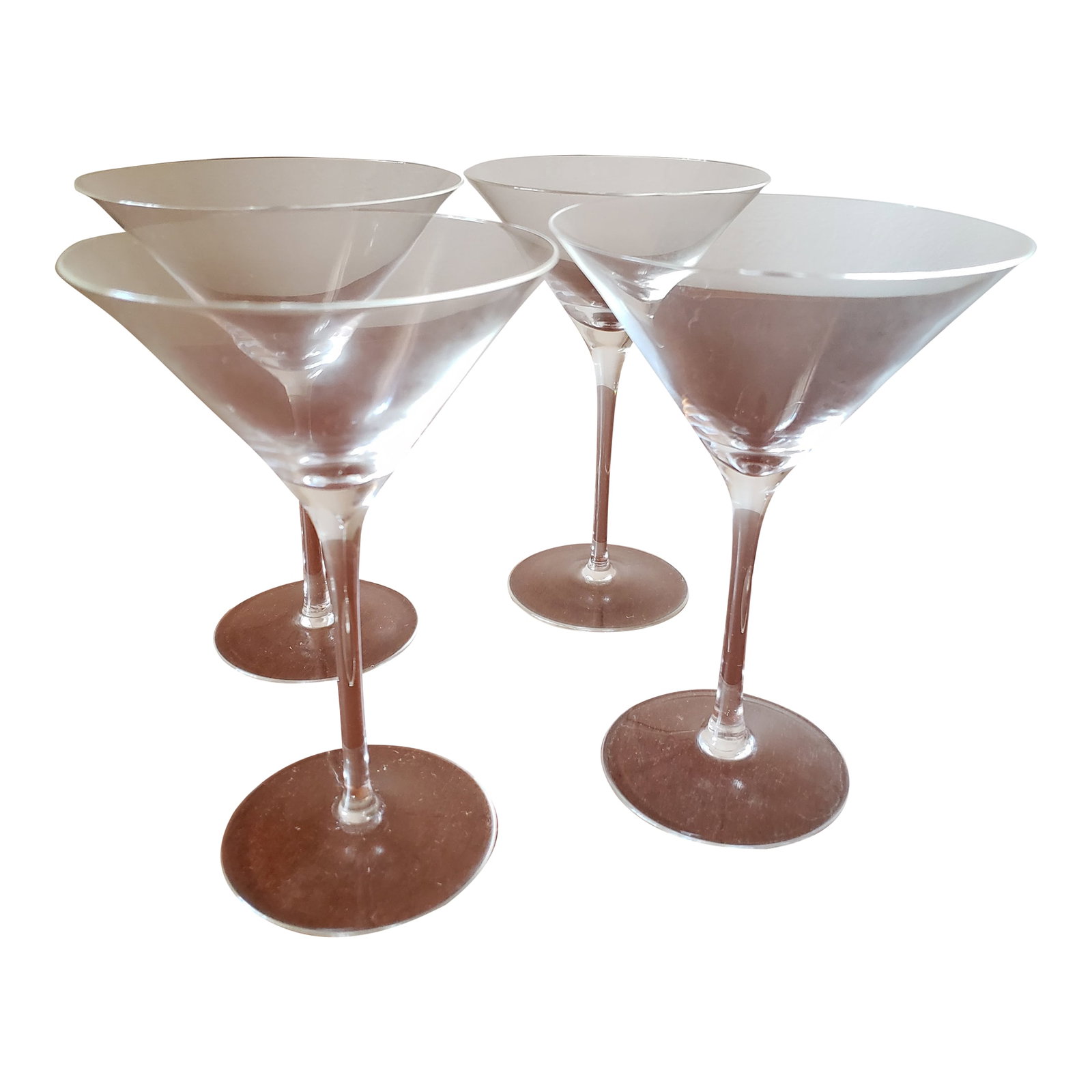 Crystal Martini Glasses - Set of 4: Set of four Martini glasses. Fine crystal, stemmed, very thin edge. Glasses are clear crystal even though the main image looks yellow and the table they are on is reflecting brown. Check all photos.