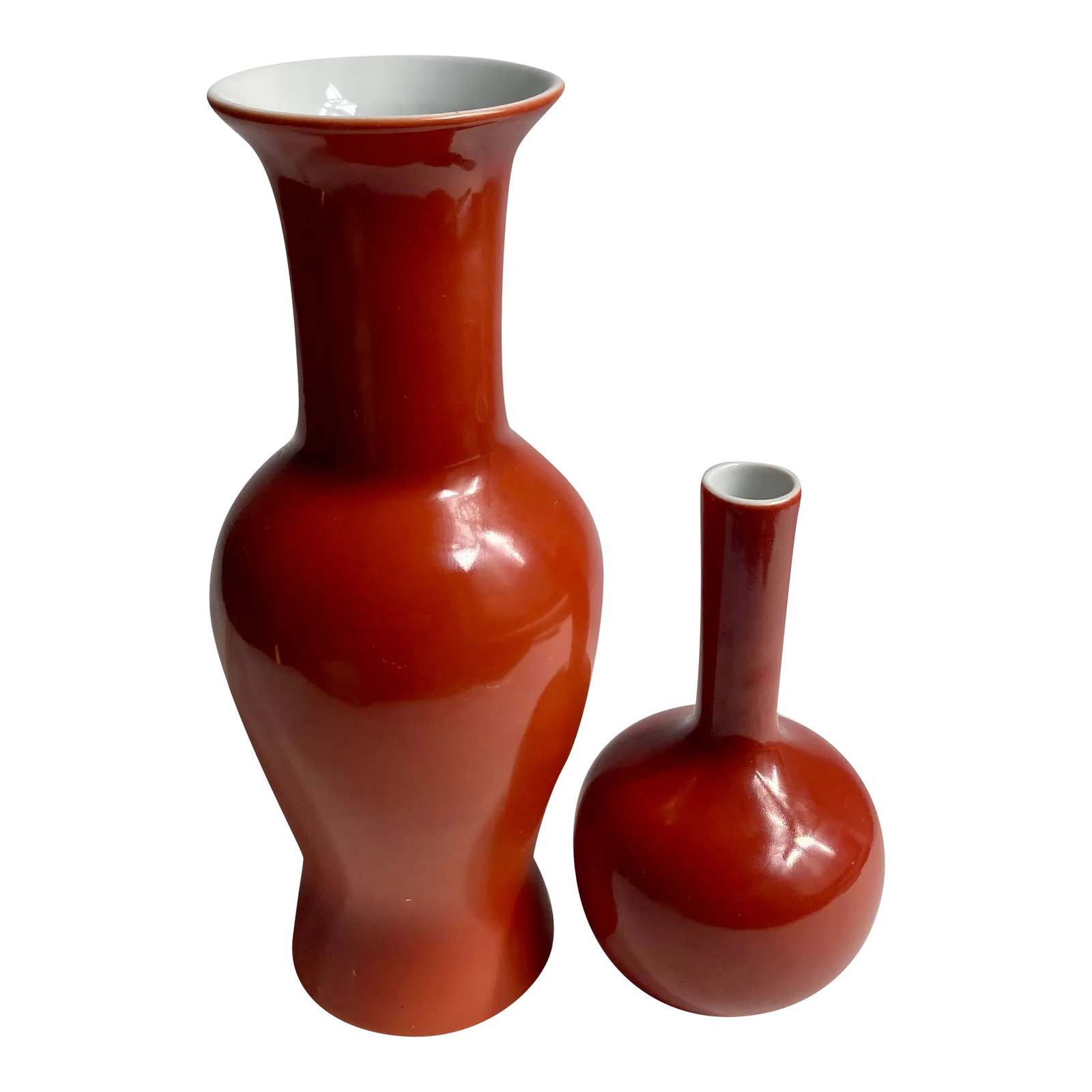 1980s Mann Red Orange "Les Vases" Pottery Vases - Set of 2: Two Mann 1980 "Les Vases" Vases in Red Orange. 1 Urn Vase. 1 Bud Vase. Featuring 2 shapes and sizes, larger Urn Vase and smaller a Bud Vase. Slight variation in Red to each vase. Each vase with White