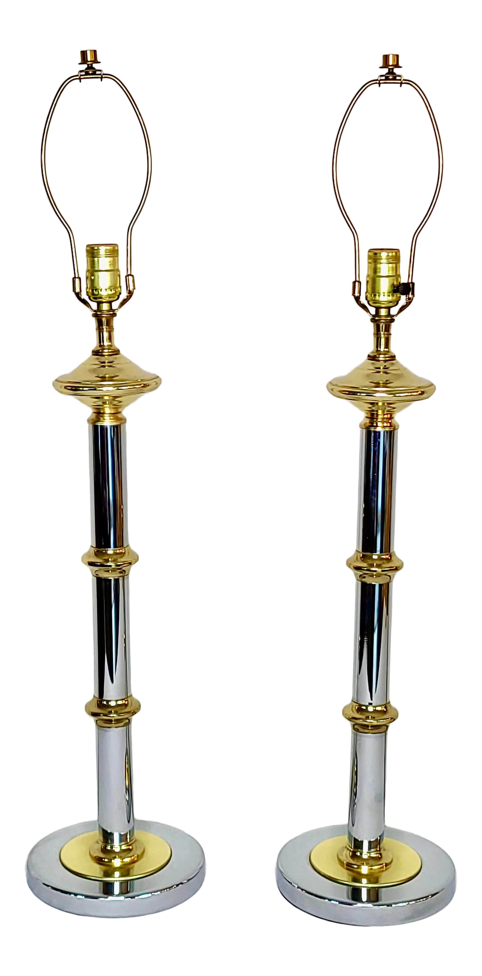 Mastercraft Chrome and Lacquered Brass Table Lamps - a Pair: A pair of Mastercraft stacked chrome and lacquered brass table lamps in a Modernist, faux bamboo style. They will fit beautifully with any mid century modern or postmodern decor with their stunning an