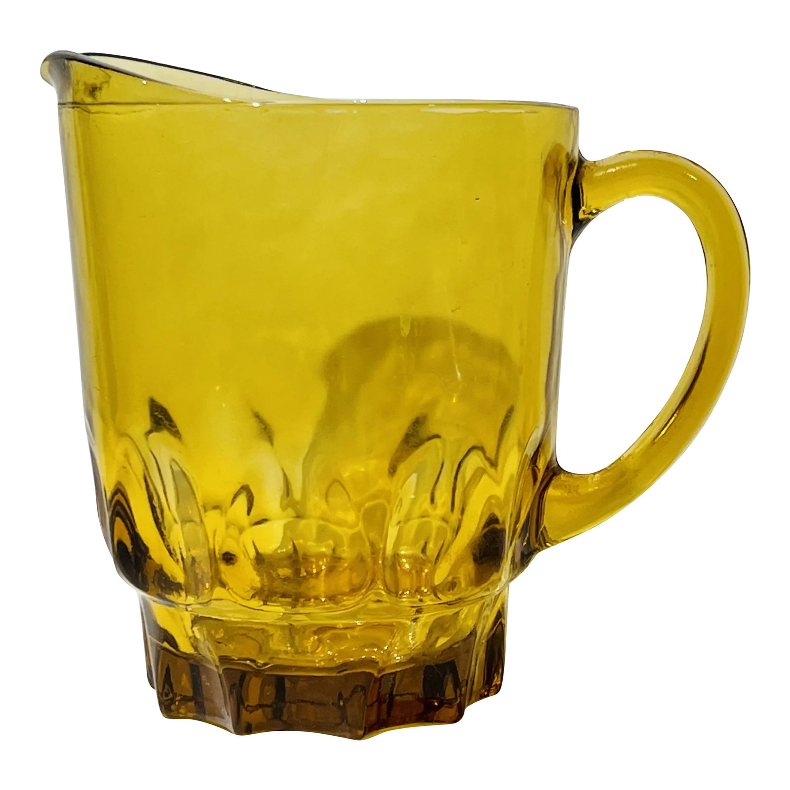 Vintage Hazel Atlas Amber Glass Thumbprint Pitcher, Heavy Handled 64 Oz Pitcher: This is a beautiful harvest gold glass pitcher made by Hazel Atlas in the 1960s. It is heavy glass with a curved handle. A large thumbprint design surrounds the bottom portionof the pitcher as well