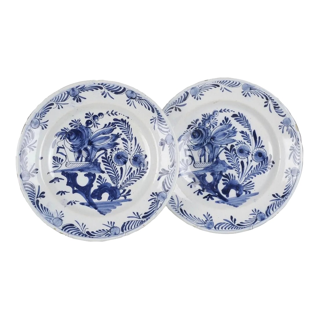 18th-Century Dutch Delft Faience Chinoiserie Plates, a Pair: A fine quality matching pair of 18th-Century Dutch Delft plates. They are hand painted in traditional cobalt blue and white with a lovely Chinese influenced chinoiserie design. The lovely floral and
