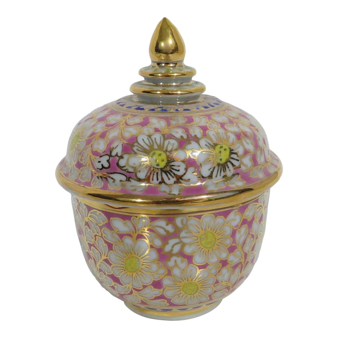 Thai Benjarong Jar: Small 1970s porcelain Thai benjarong jar with a cotton candy pink base. There are hand-painted white blossoms with yellow centers, and reticulated decoration in gold, red, blue and green. Good conditi