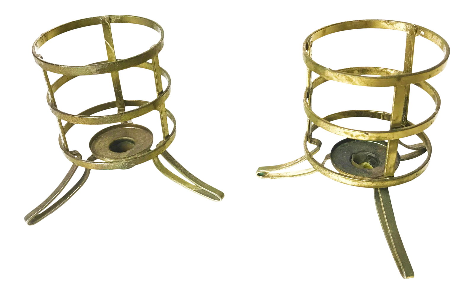 Vintage Mid-Century Brass Candle Holders - a Pair: Vintage mid century pair of brass candle holders. These pieces feature a classically shaped brass base with three feet and the option for holding multiple candle sizes. The bases have a slot for small