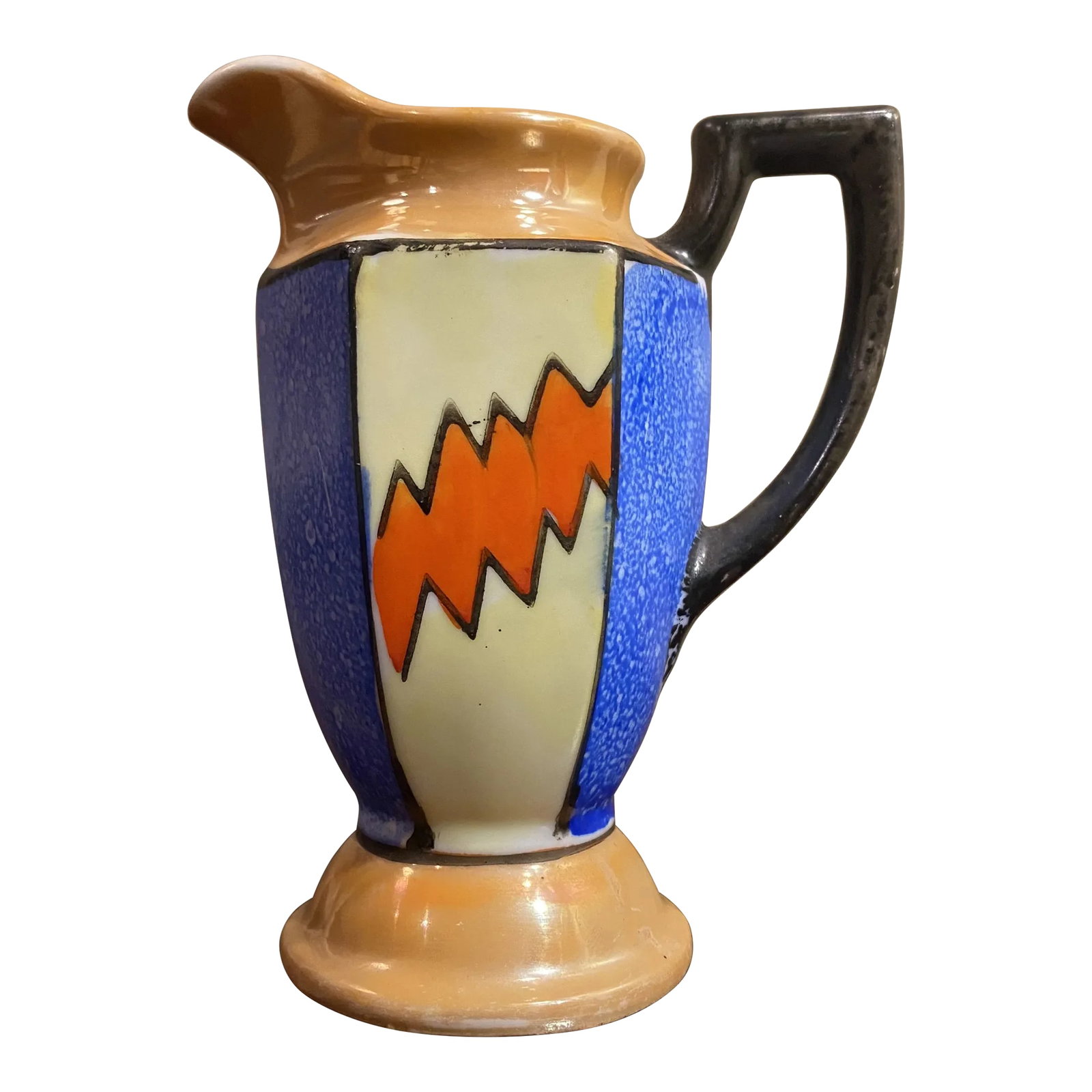 Vintage Lusterware Creamer in the Manner of Clarice Cliff: A fun and funky coffee creamer, hand painted and made in Japan. Although the shape of the piece is more traditional, The vibrant glaze pattern is reminiscent of Clarice cliff's work. Condition: