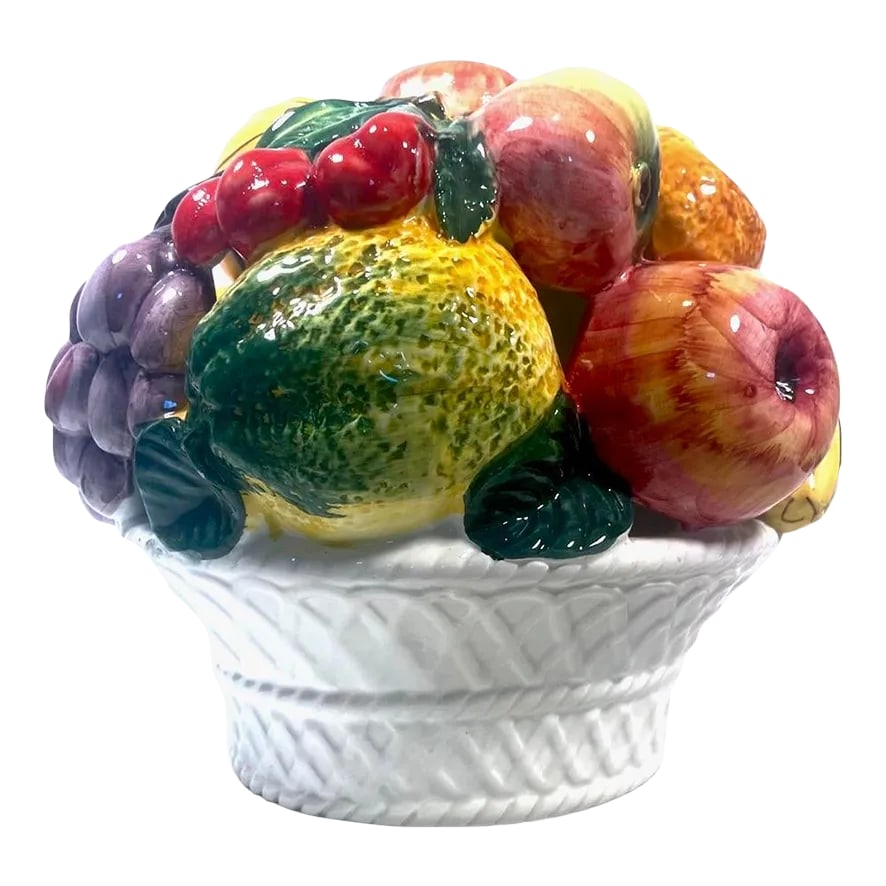 Vintage Italian Fruit Topiary: A beautiful and delicate porcelain topiary with a bright burst of color with assorted detailed fruit and curled leaves perched on a white basket. Bananas, purple grapes, red apples, lemons and also