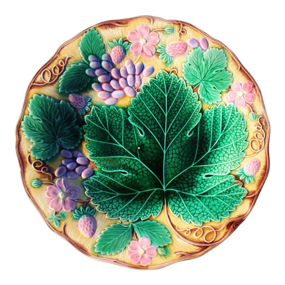 1940s Wedgwood Majolica Strawberries and Leaves Plate: This is one of my absolute favorite Wedgwood majolica patterns. The background is a warm yellow, and the grapes and strawberries are rendered in pink. The deep green of the leaves is so richly intense