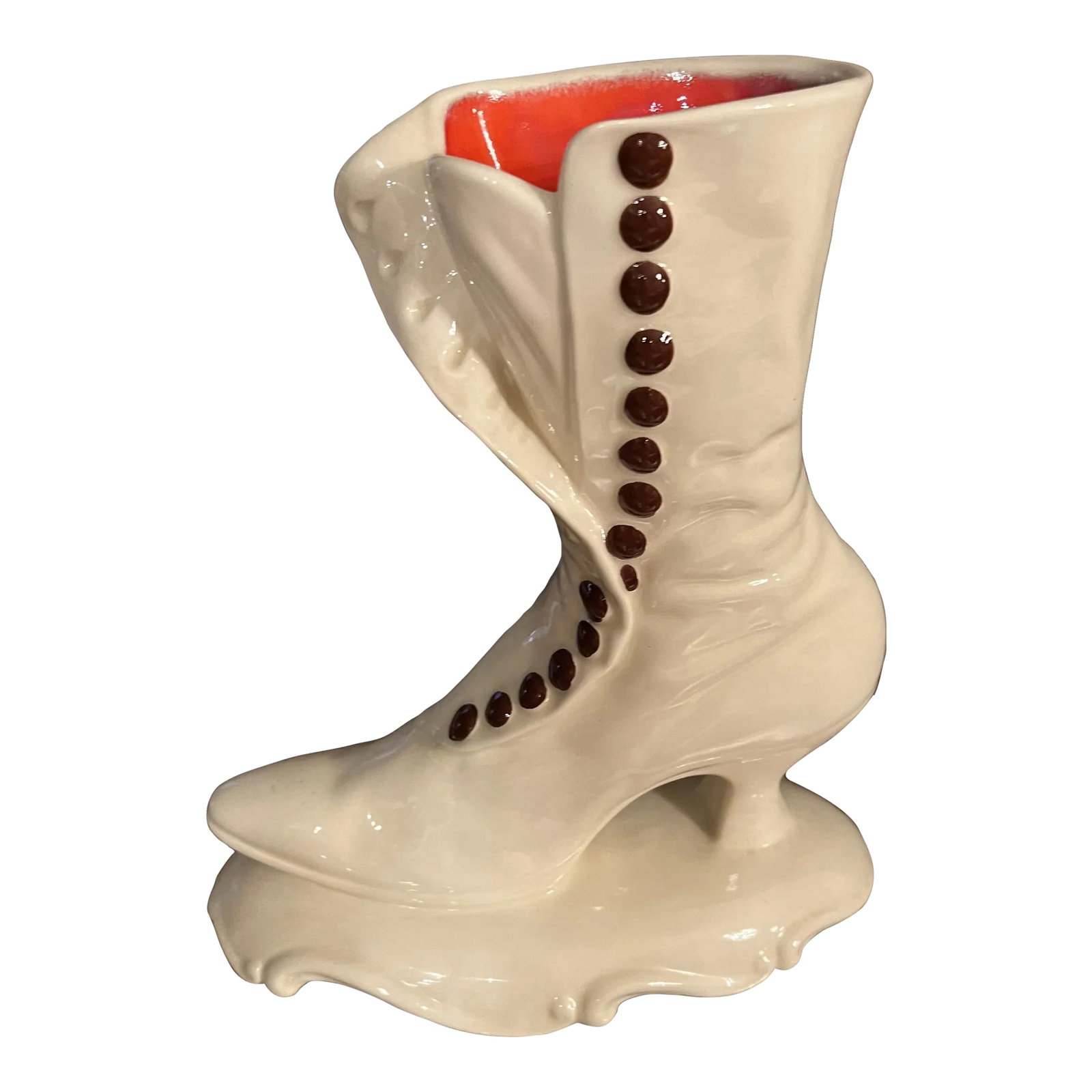 Vintage Late 20th Century Victorian Ceramic Women's Shoe: Beautiful ceramic statue of a victorian style ladies shoe / boot with a bright color of red on the inside. Signed on the bottom by Atlantic Mold Company. This could be used as decor on a shelf as it