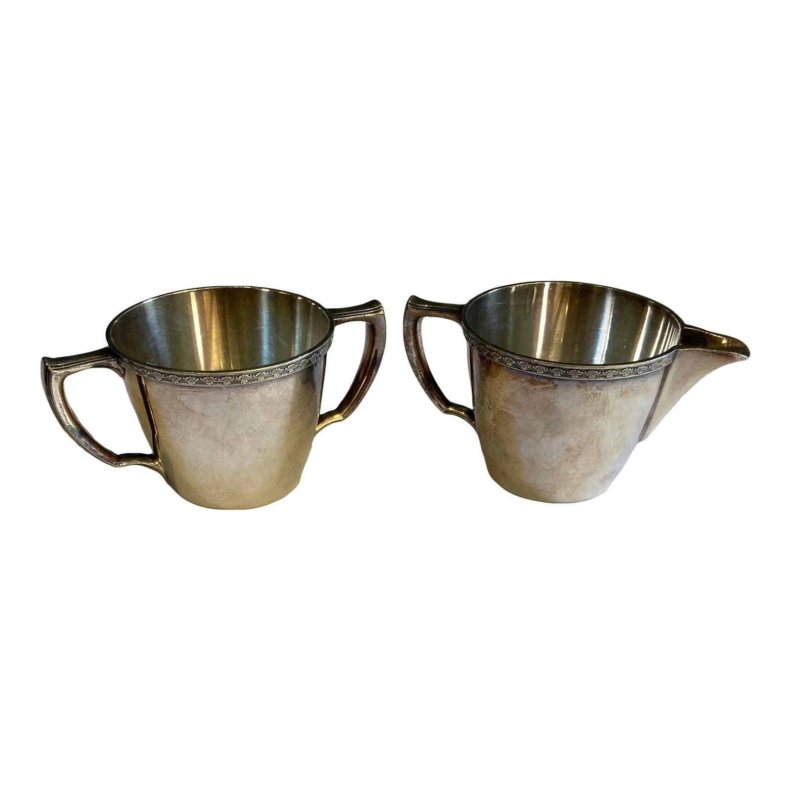 1930's F B Rogers Silver Plate Creamer & Sugar Bowl: A timeless Rogers EPNS silverplate creamer and sugar bowl set, showcasing classic form with understated decorative detailing along the rim. The set includes a handled sugar bowl and a matching
