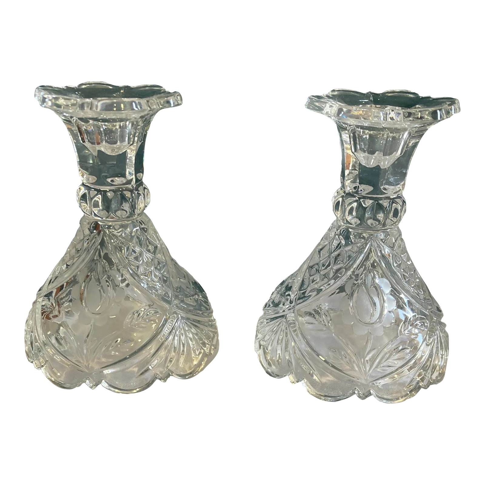 Vintage Cut Glass Candleholders, Set of Two: This pair of vintage clear cut glass candlesticks features a traditional silhouette with pressed and cut-style detailing that catches and reflects light beautifully. The balanced form and classic desi