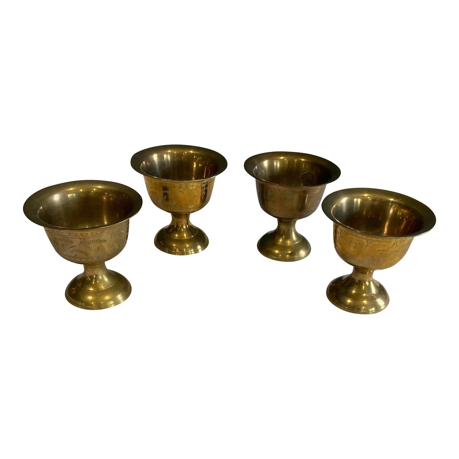 Set of 4 Vintage Etched Brass Goblets: This striking set of four vintage etched brass goblets adds timeless global charm to any space. Each piece features intricate hand-engraved details and a rich golden patina. Ideal as accent decor,