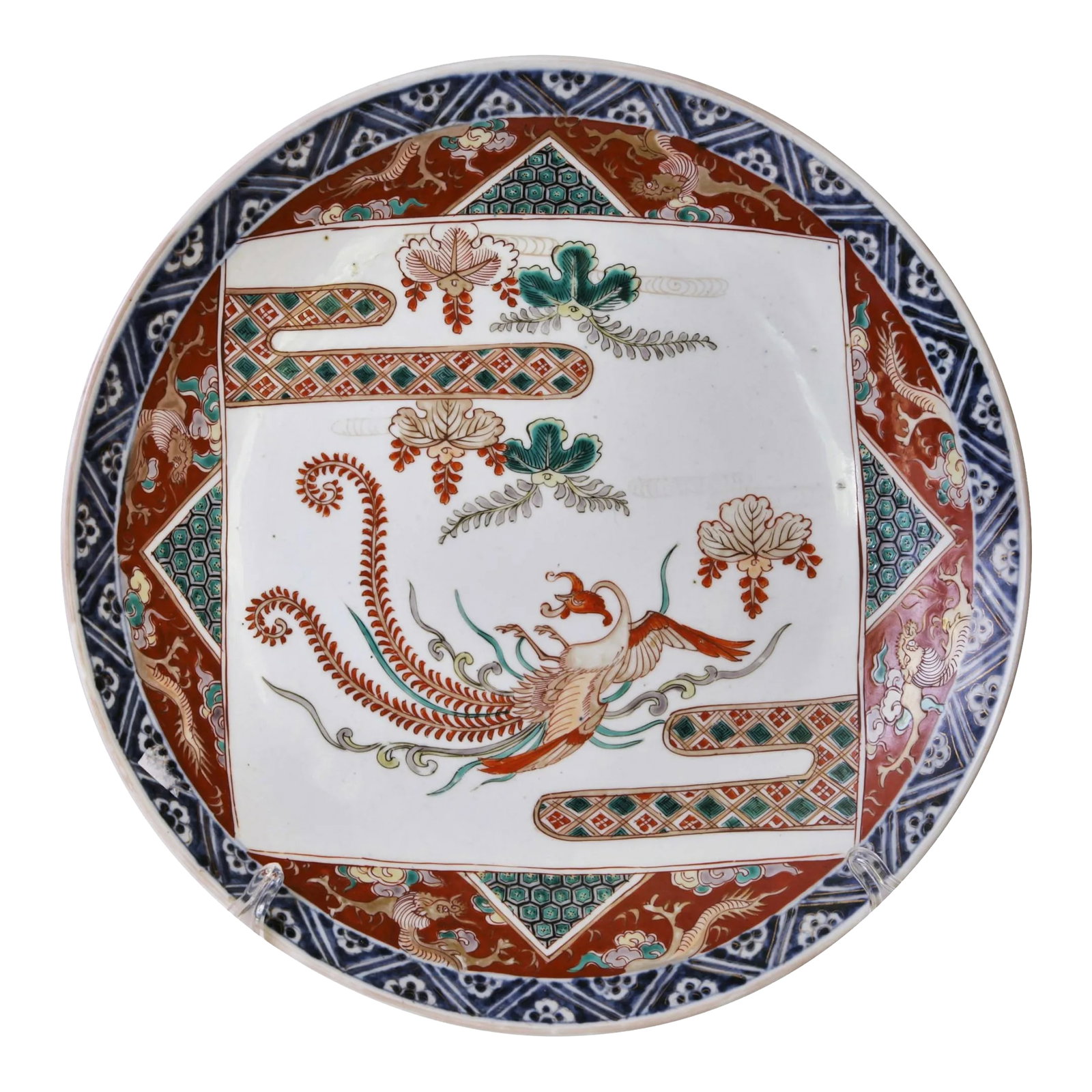 19thC Japanese Charger -Flying Phoenix - C. 1880-1900 - 15in: A strikingly hand-painted imari masterpiece from the late 1800's. Remarkably well cared-for. A highly-stylized phoenix is at the center surrounded by flowers and leaves. The cobalt blue rim is