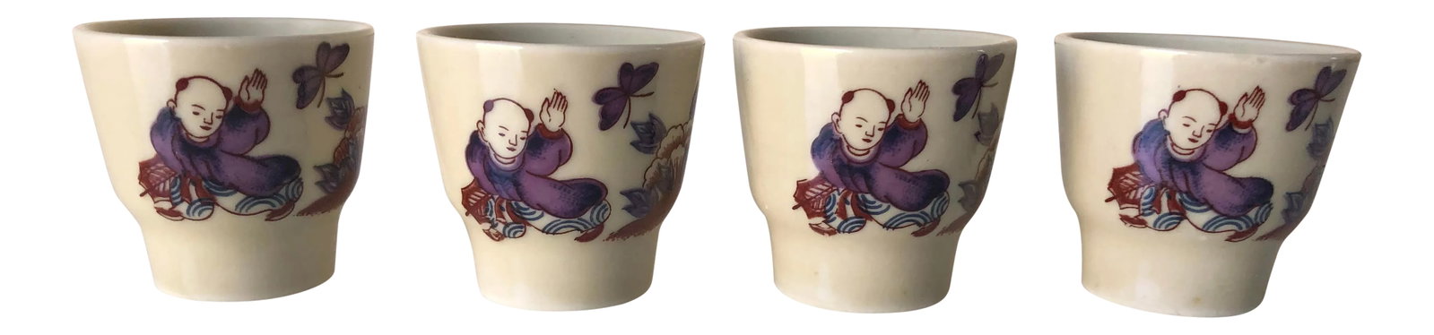 Vintage Japanese Ceramic Saki Cups S/4: Vintage purple and blue decorated,set of four ceramic Japanese saki cups with butterflies and a man figured, marked "Japan " they are in excellent condition. 1.75"W X 2"H Condition: Alterations:
