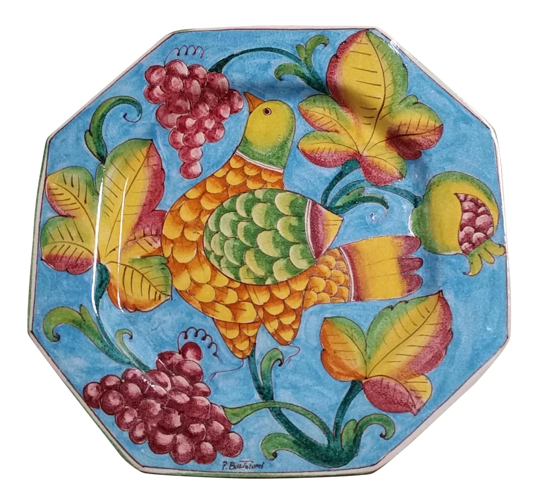 Vintage P. Bartoloni Italian Decorative Hanging Plate: Signed P. Bartoloni, this large decorative octagonal hanging plate is a lovely and colorful piece that encompasses flora and fauna. The bird blooms from the grape vine. This piece consists of heavy st