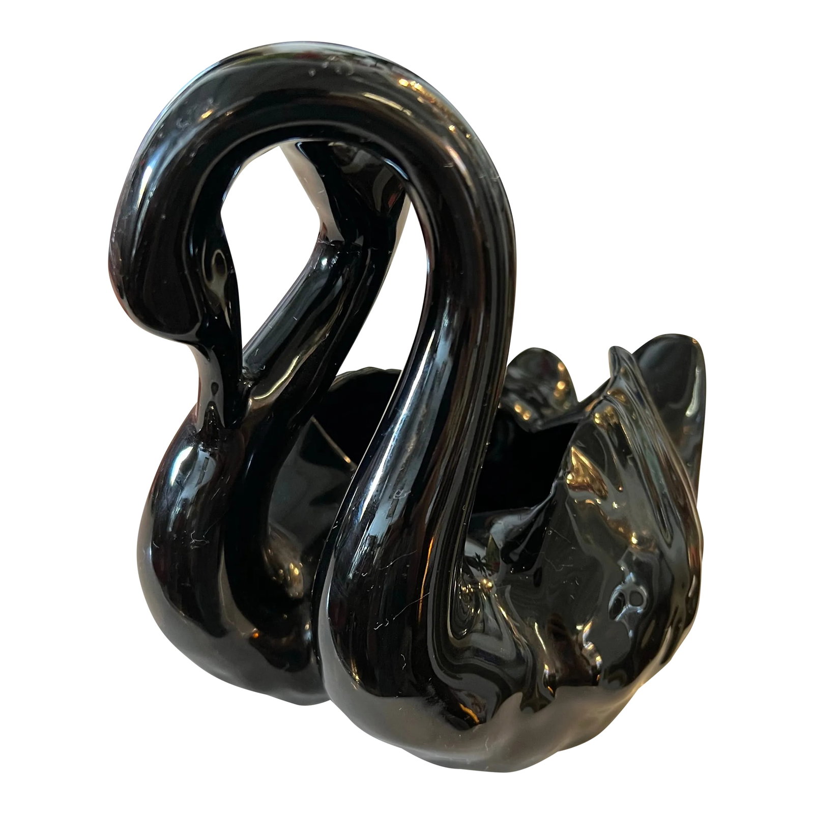 Mid 20th Century Black Swan Planter: Black ceramic double swan planter. Unmarked made by Camark. Highly glazed pottery. In excellent condition. No chips or cracks. Camark Pottery started in 1924 in Camden, Arkansas. Jack Carnes founded t