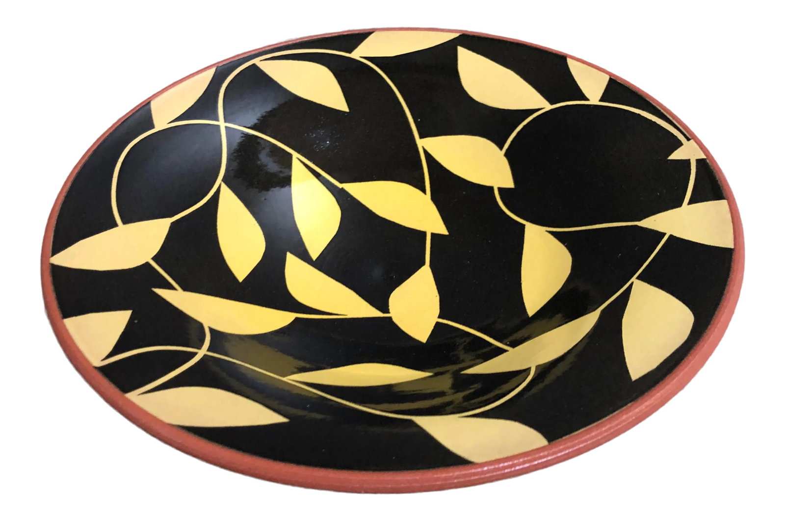 Black and Yellow Pottery Bowl With Clay Color Exterior: Great looking bowl to be placed into most any interior. Fun leaf design. Love the black background on this piece. Purchased at the San Diego Potters Association Sale. Has been sitting in my