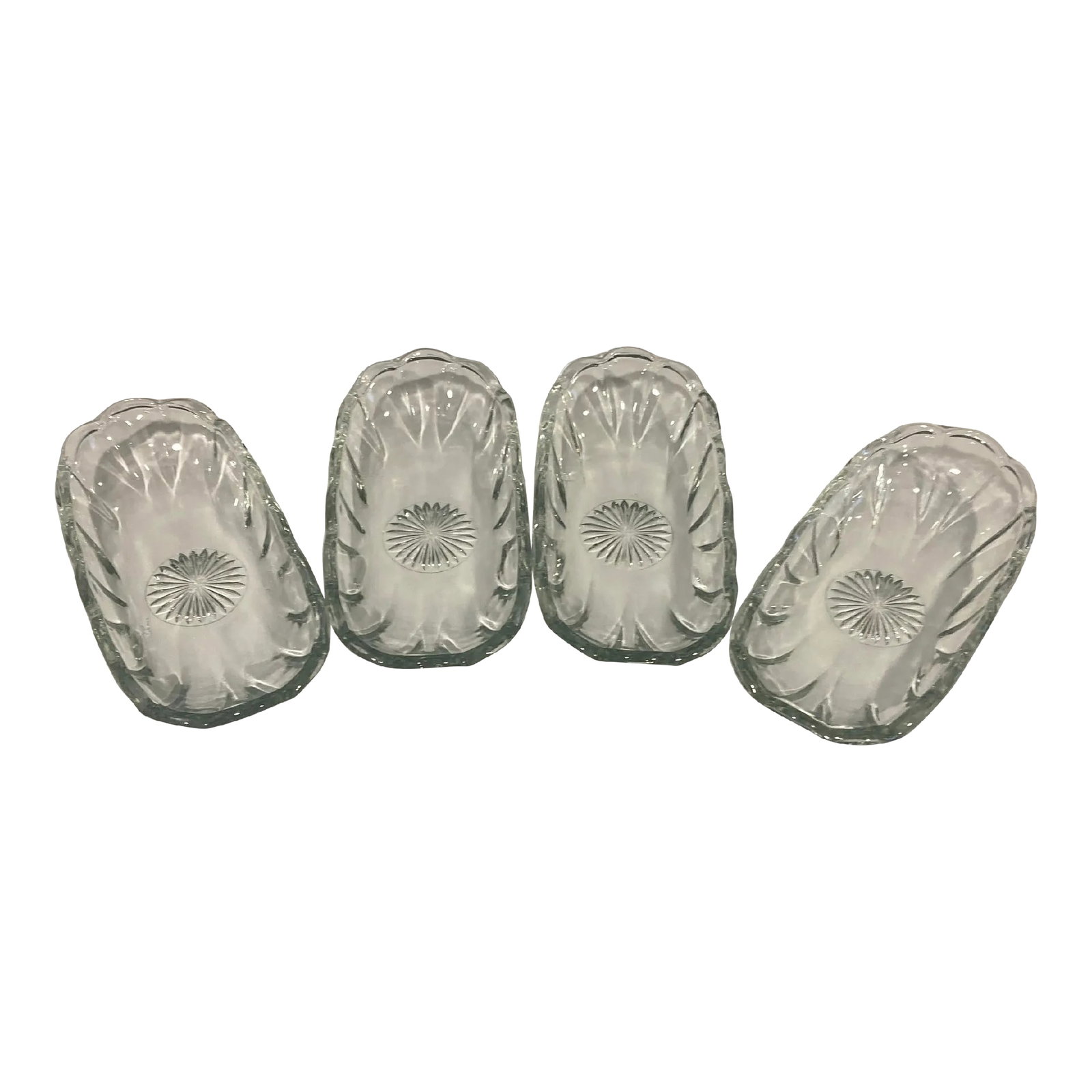 Vintage Clear Glass Corn-on-the-Cob Dishes With Sunburst Design, Set of 4: A beautiful set of four vintage corn-on-the-cob dishes, crafted in clear glass with a gently scalloped rim and a molded sunburst design at the base. These elegant trays are as functional as they are d