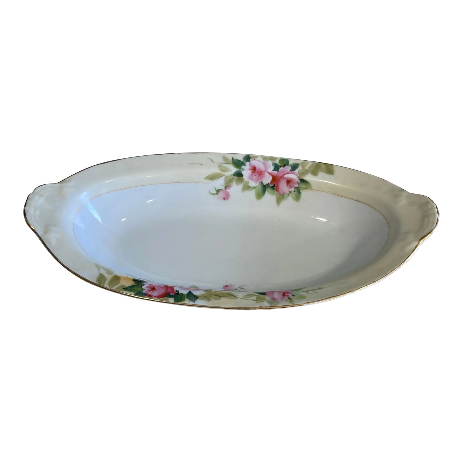 Vintage Noritake Nippon Hand-Painted Pink Rose Oval Serving Bowl: A charming vintage Noritake Nippon oval serving bowl featuring hand-painted pink roses, soft green foliage, and delicate gold trim. This elegant porcelain piece reflects the fine craftsmanship and