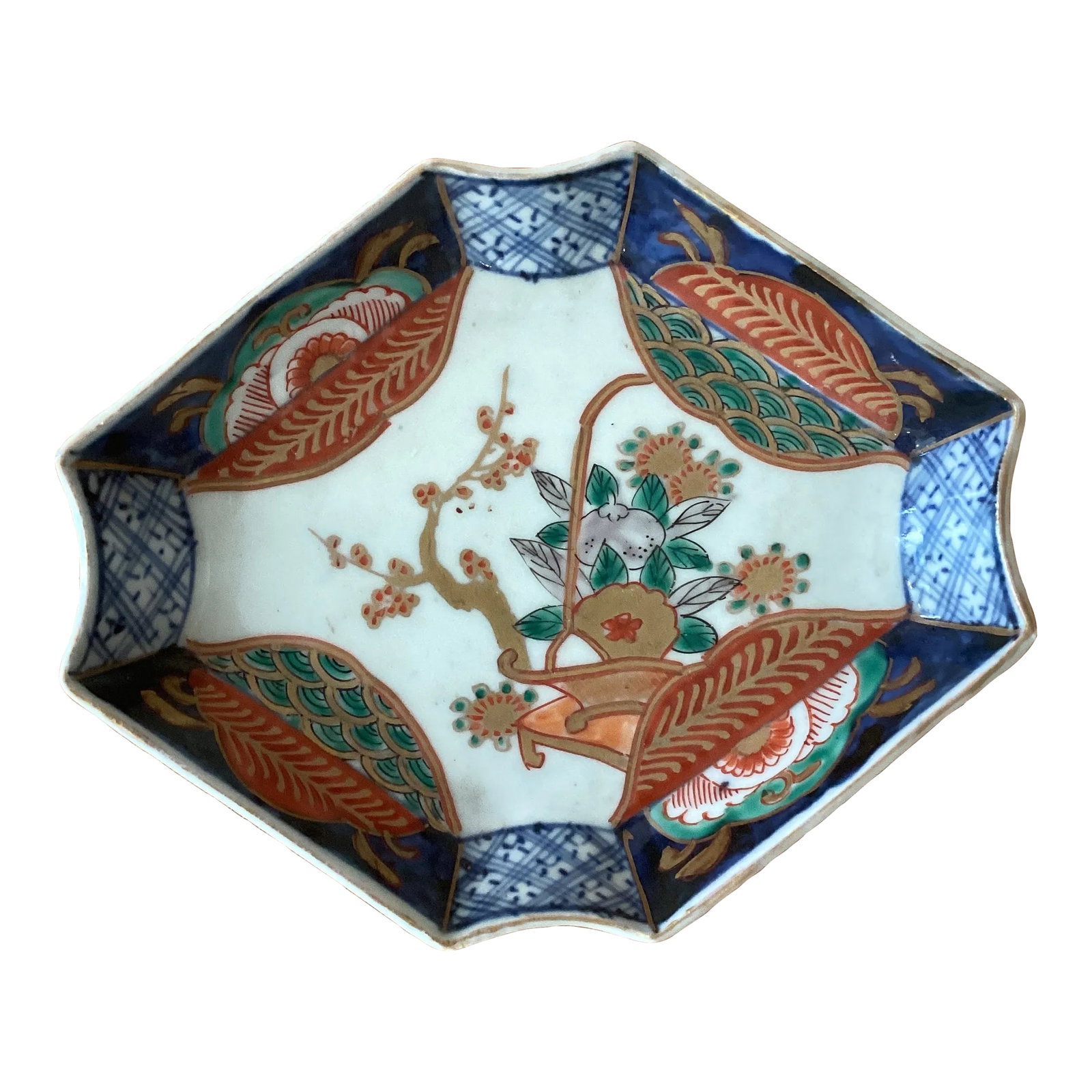 Japanese Imari Porcelain Rectangular Small Bowl Late 18th Century: Japanese Imari Porcelain Rectangular Small Bowl Late 18th Century The interior edge with repeating pattern of stylized foliate surrounded by a navy- blue ground and tree and flowers in the center.