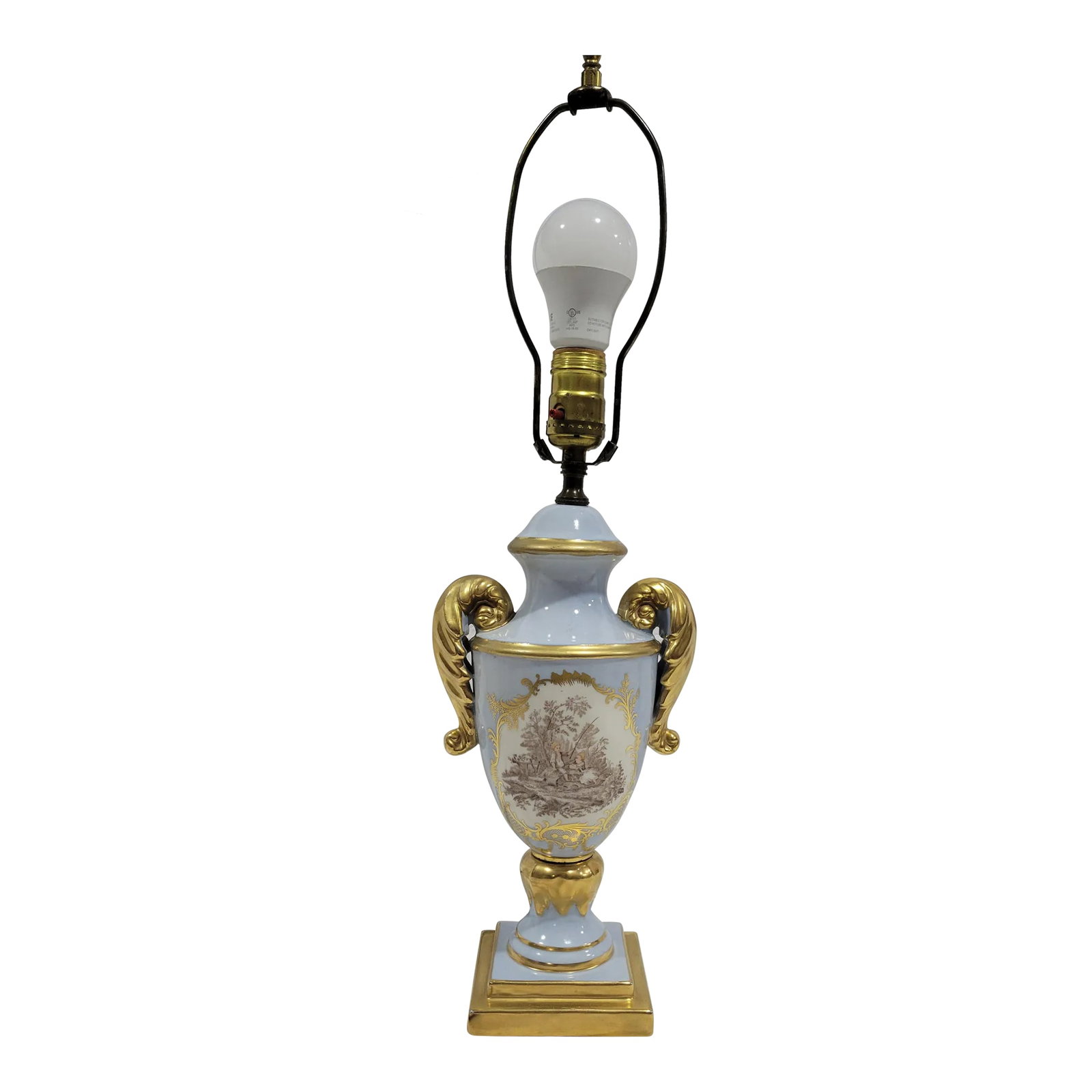 Vintage French Provencial Style Porcelain Table Lamp: Delicate French Provincal Style Table Lamp. Made of porcelain glazed in a pastel blue with gold accents. One one side is a painted scene of children playing. Brass lamp harp and finial. Most likely