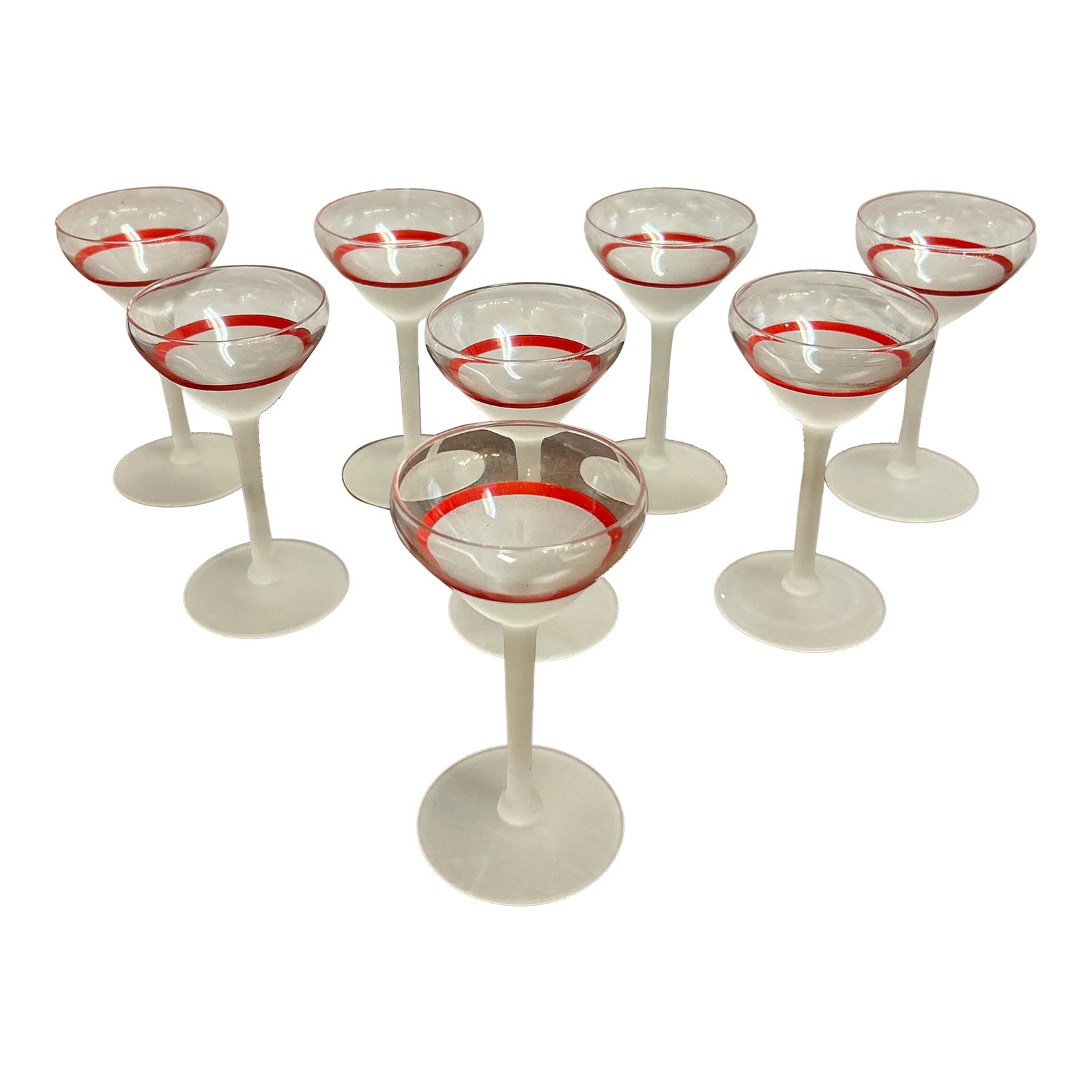 Transparent Frosted and Red Cocktail Glasses Set of 8: Very attractive set of eight small cordial cocktail glasses. They have a transparent top band and a red stripe then frosted the rest of the way down the glass, stem, and base. They're fun, they're pet
