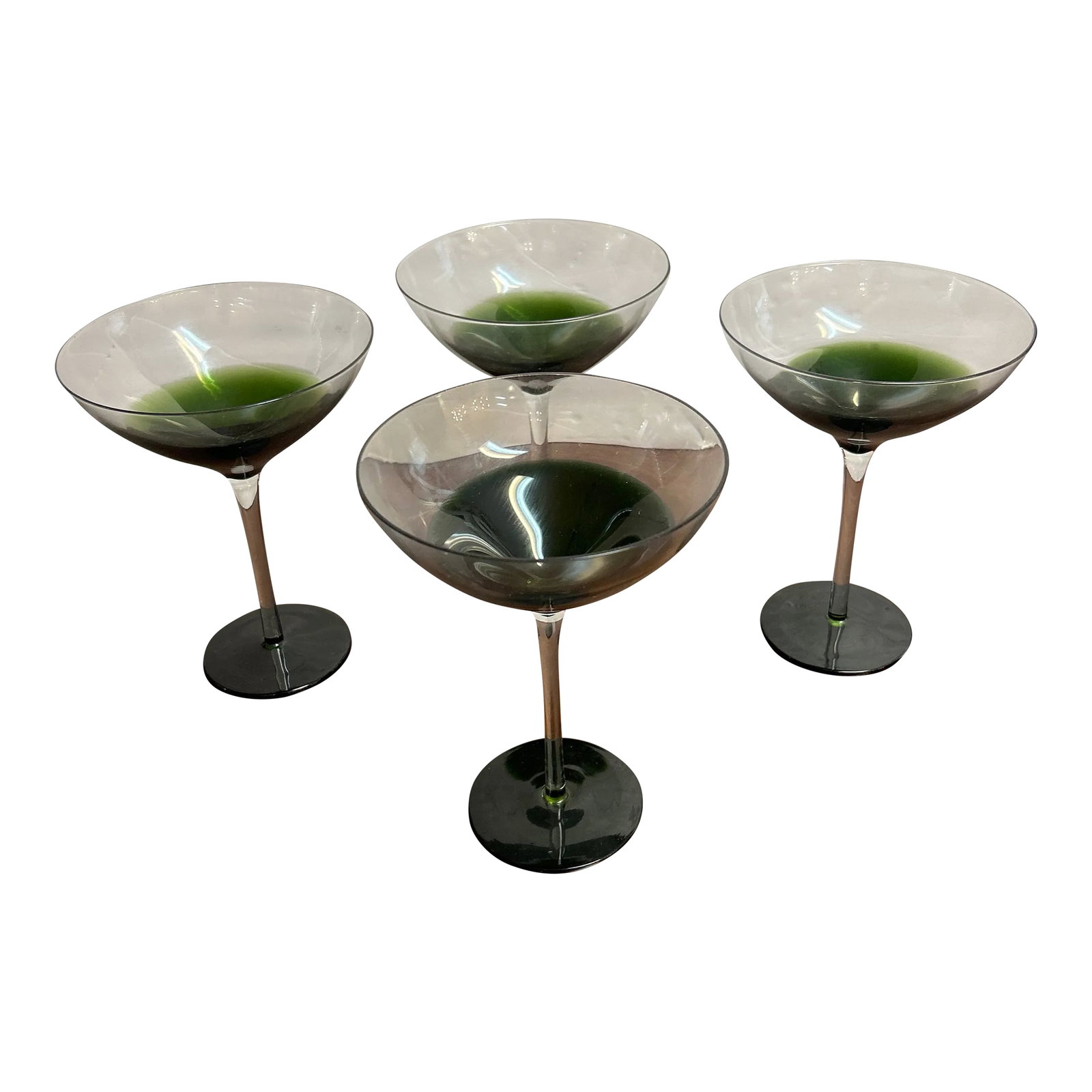Green and Transparent Tall Stem Cocktail Glasses Set of 4: Very attractive set of 4 cocktail glasses. Transparent tops fading into green with clear stems followed by the green base. Great for all types of cocktails the mixologist in you can be completely crea