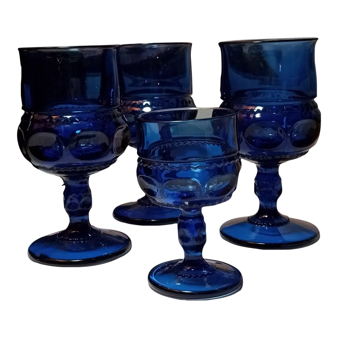 1960s Indiana Glass Kings Crown Cobalt Blue Goblets - Set of 4: These goblets were made in the 1960s by the Indiana Glass Company. The pattern is called Kings Crown and are a beautiful cobalt blue. Three goblets measure 5 3/4" high and one is 4" high. These would 