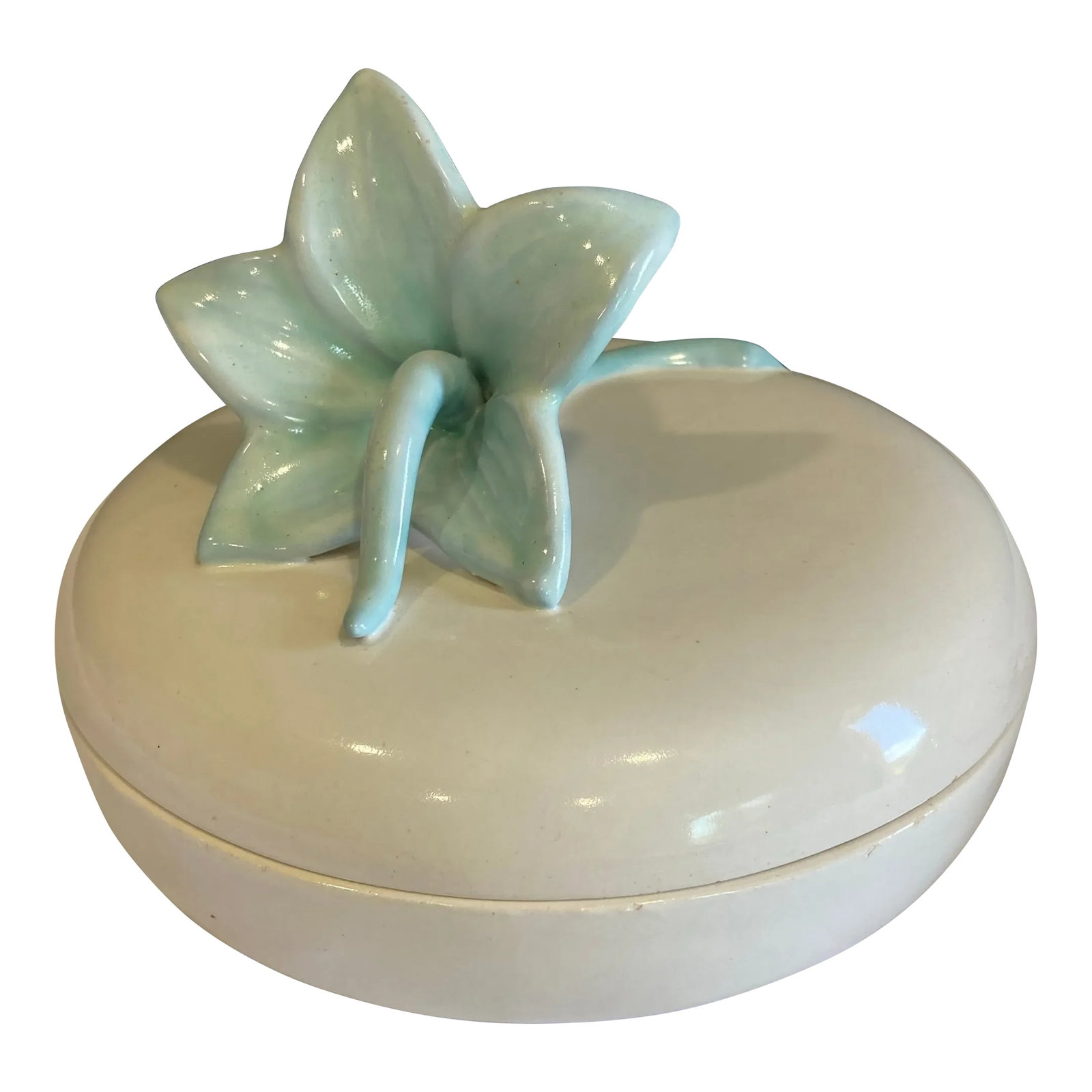Royal Haeger White Ceramic Covered Dish With Blue Lily: A beautiful midcentury covered dish by Royal Haeger featuring a white glazed ceramic body and a sculpted blue lily top. Sophisticated and timeless, this piece brings a soft decorative touch to a