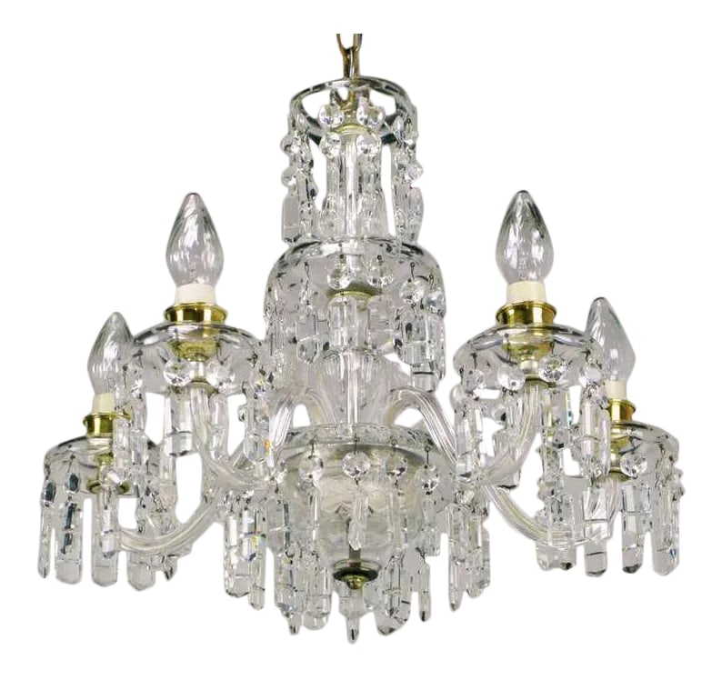 Lightolier Cut-Crystal Five-Arm Chandelier, Circa 1940s: A wonderful early example of the craftsmanship of the American lighting pioneer, Lightolier. Five glass arms meet at the bottom the tri-tiered cut-glass centre column. Brass cups under the sockets can
