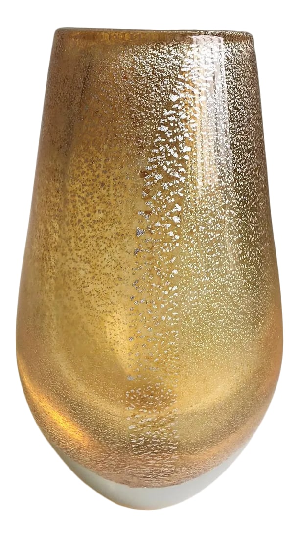 Italian Gold Glass Stardust Vase: A heavy glass vase of gold / pale amber glass with encased silver foil flecks. It is made in Italy using a centuries old Murano technique where a glass master rolls small .925 silver sheets onto a