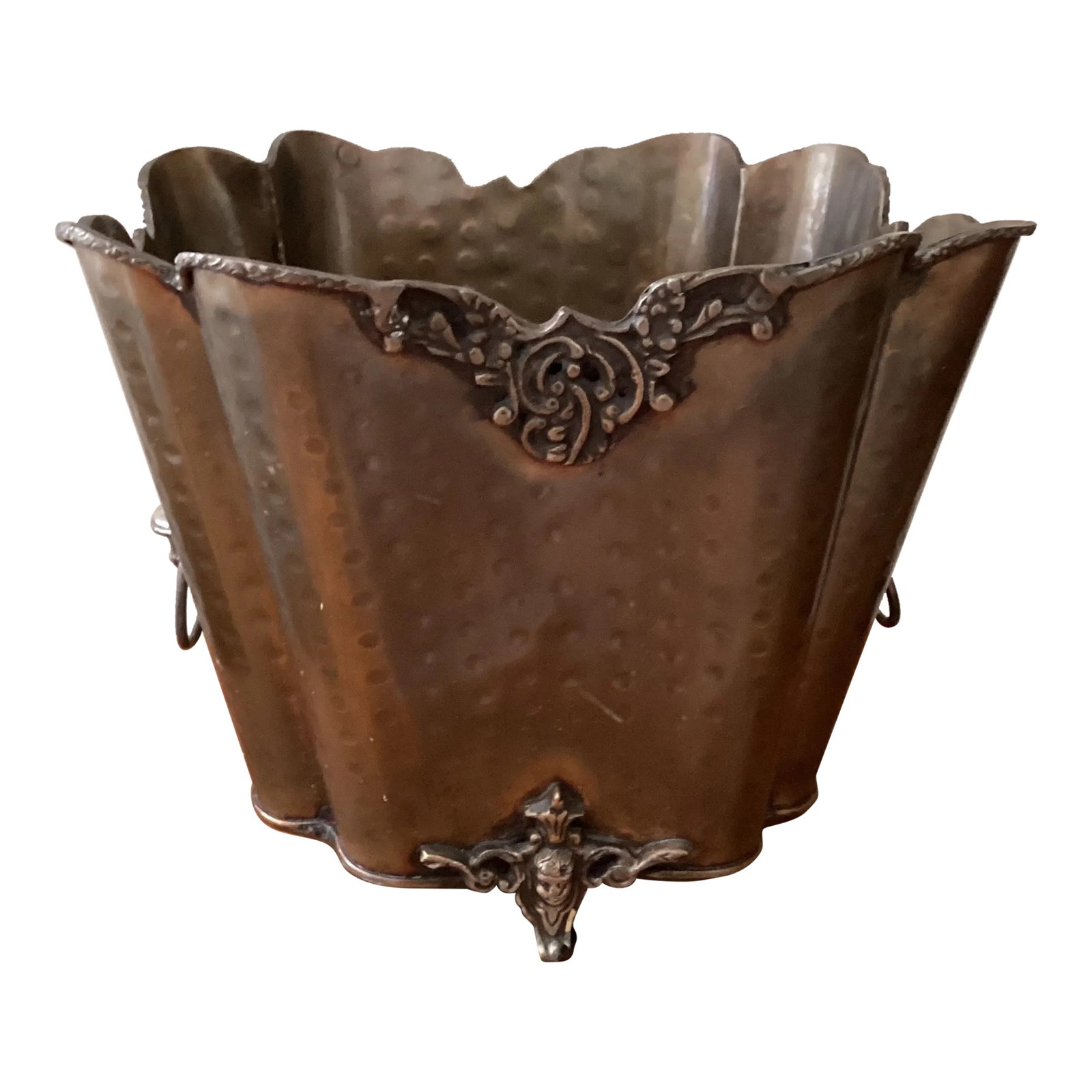 Vintage Hammered Brass Footed Cachepot/Champagne Basket/Planter With Handles: The antique bucket stands on paw feet side, has ring handles and is decorated with repousse decor. The cachepot/Champagne basket with a rich patinated finish and could be used as a planter or a waste 